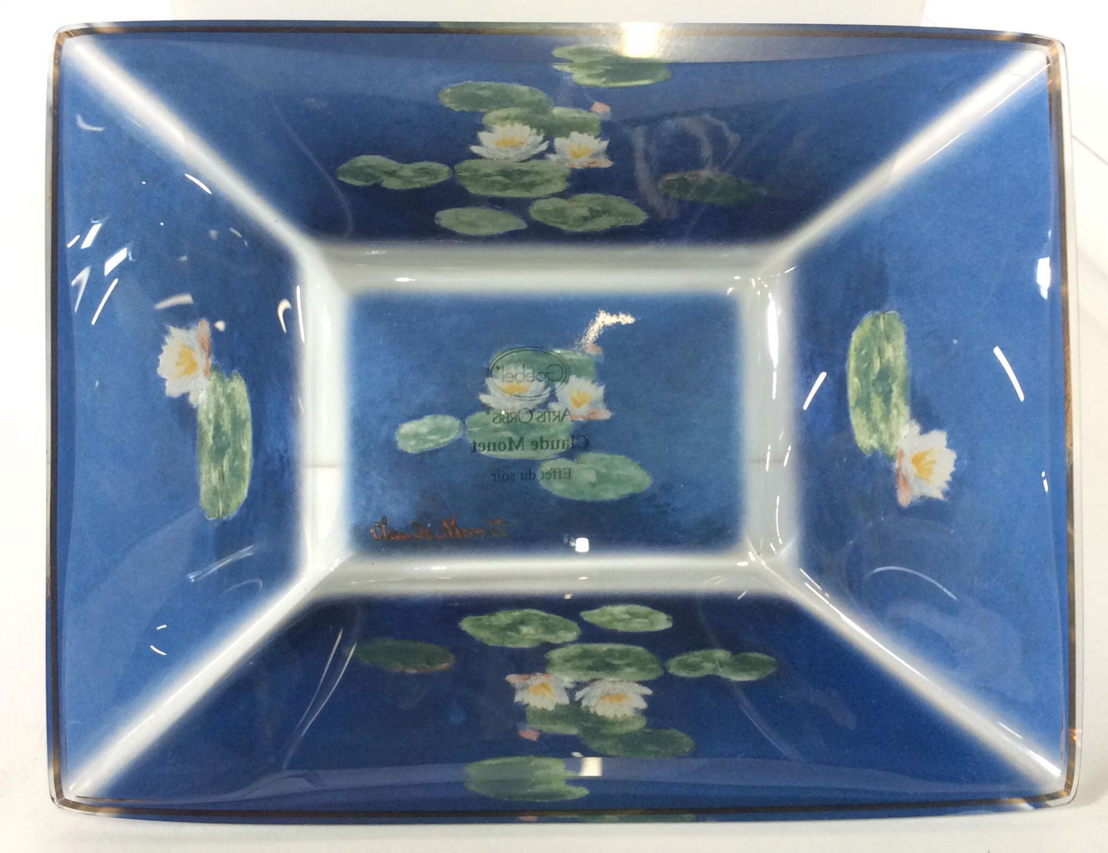 GOEBEL Artis Orbis ‘Claude Monet’ Glass Bowl: Trademark Claude Monet Water Lillies On Glass. App 7.5 x 5 3/4 in. LxW. Ht. 2 in. Museum Quality Glass Art, Claude Monet Water Lillies On Glass, Glass Bowl, Trinket Bowl, Art Glass, Goebel Artis Orbis