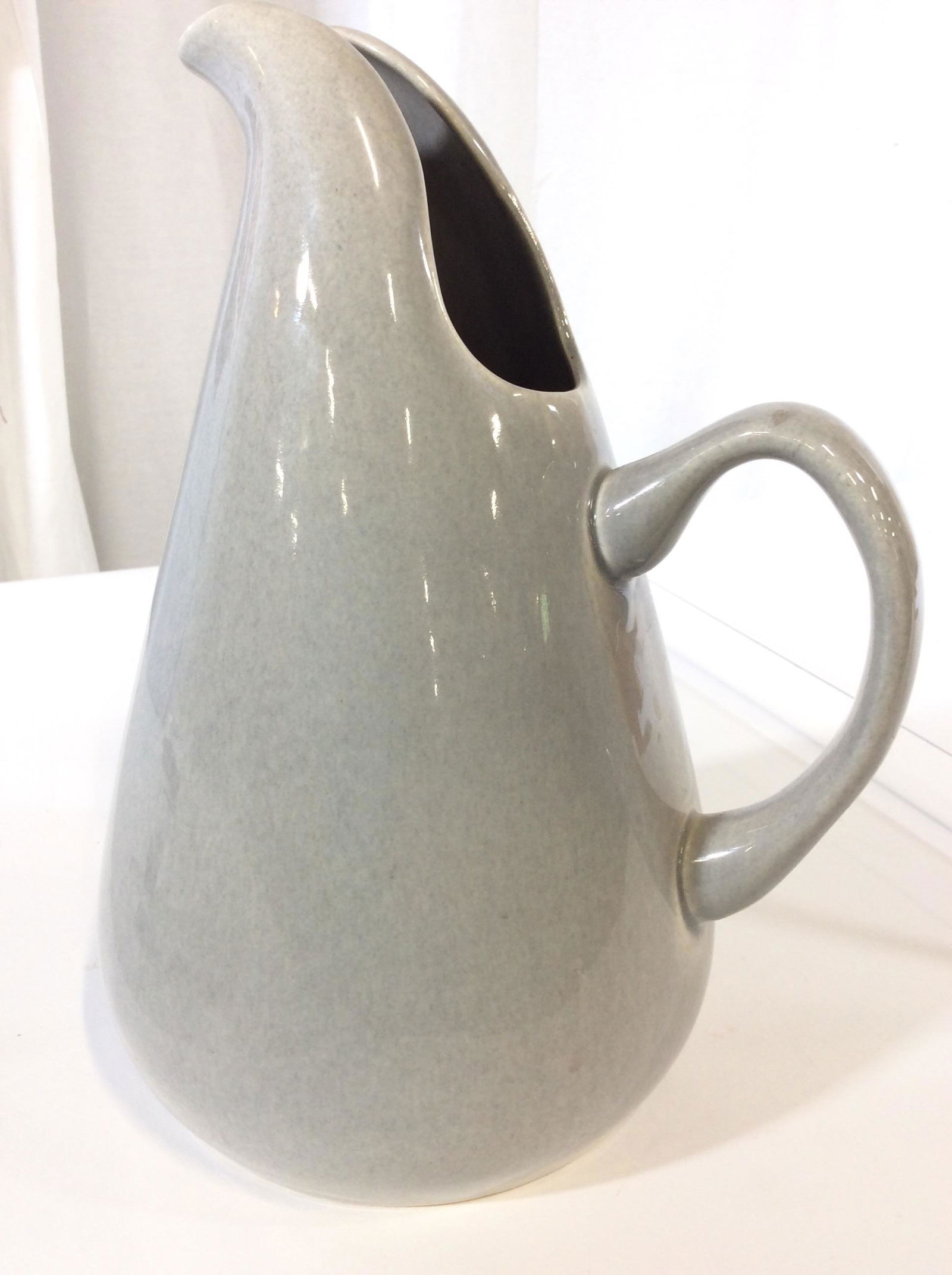 Signed RUSSEL WRIGHT Porcelain Pitcher: Corresponds with lot # 741 The Russel Wright American Modern line. Underside labeled with maker’s signature RUSSEL WRIGHT impressed with script writing. Also marked MFG by STEUBENVILLE. Beautiful Do