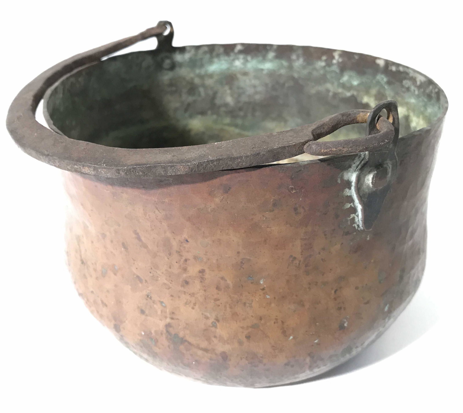 Antique Hammered Copper Pot W Handle: Pot is antique. Piece is hammered copper. Contains arch shaped handle. Pot, antique pot, vintage pot, hammered copper pot, antique hammered operations pot, handled copper pot, kitchenware, piece measu