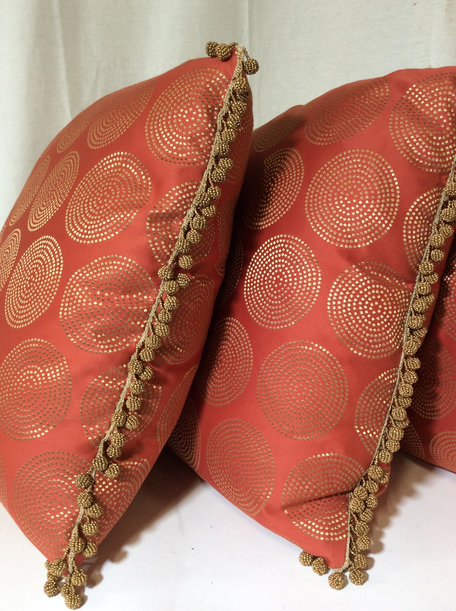 Set 4 Custom Made Feather Down Throw Pillows: Like New Designer Feather Pillows. Pillows are designed by Upscale Designing Firm Cullman & Kravis Design. Metal Beaded Ball Tassel Trim. Gold Threaded Mandala Reticulated Pattern On Persimmon Color F