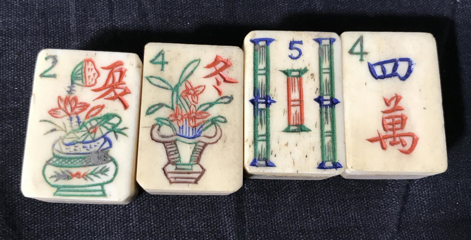 Hand Carved Mahjong Set: 144 pieces. Hand Carved Mahjong set in hand painted box, each tile has wooden bottom with hand carved and painted top, text interior of box lid reads Â‘Choicest Japan Black Tea Grown Makinghara Tea