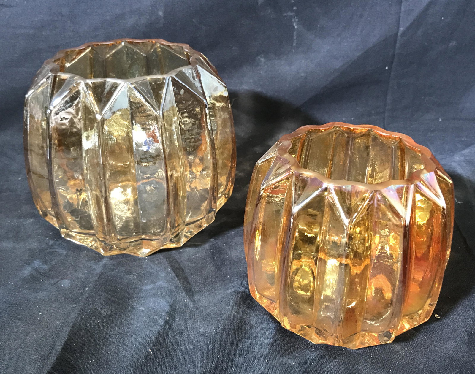 Pair Pearlescent Amber Glass Candle Holders: Pair of amber colored glass candle holders, mold blown pumpkin style glass blowing, pearlescent gloss to the glass, one measures 5 inches Tall the other measures 4 inches tall, Glass, candle holder, t