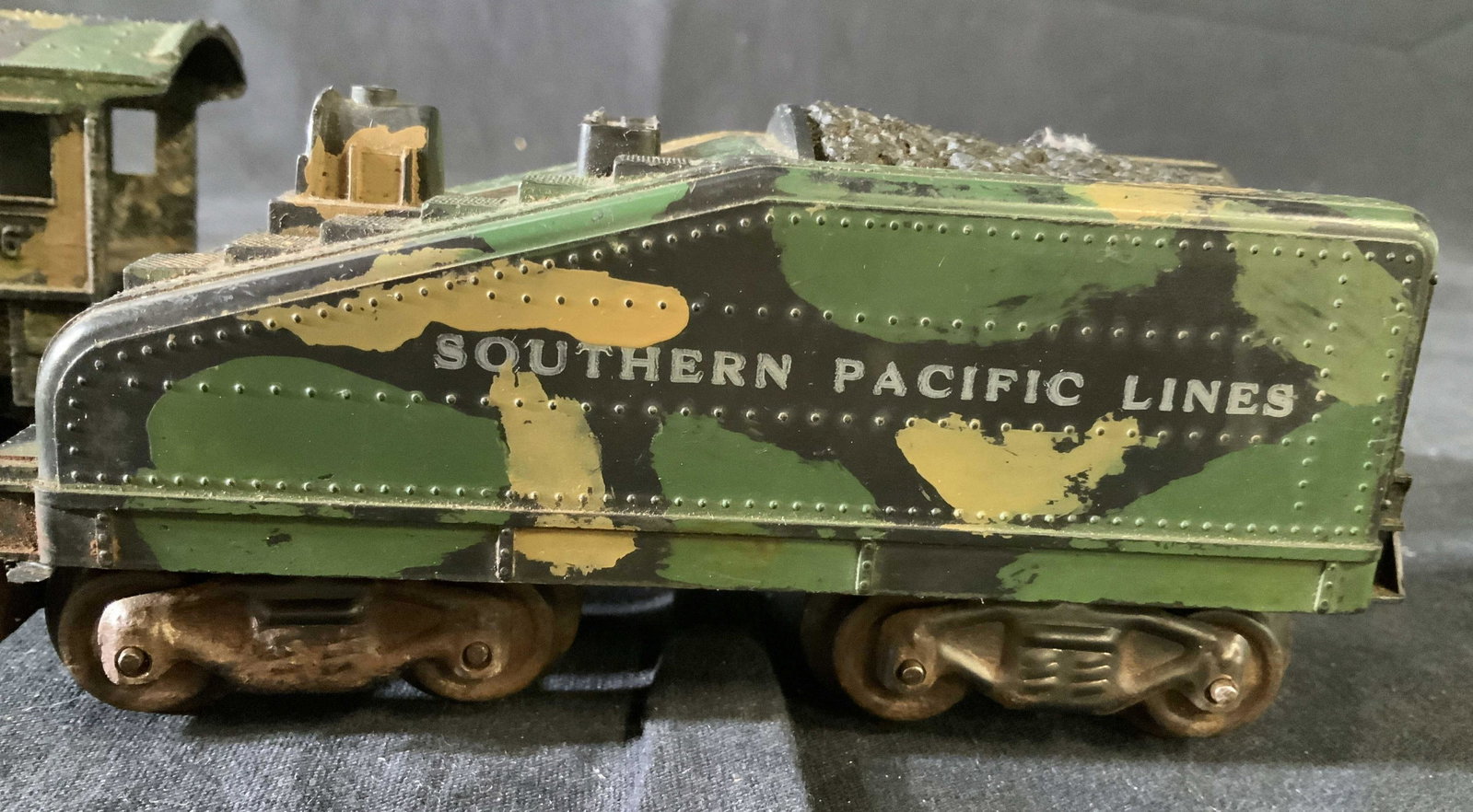 Vintage Southern Pacific Metal Iron Trains Toy: Vintage iron metal toy, collectible two trains, camouflage paint. One reads Union Pacific lines, larger measures ht 4 inches length 10 inches, army toys, vintage military toys, trains,one reads made i