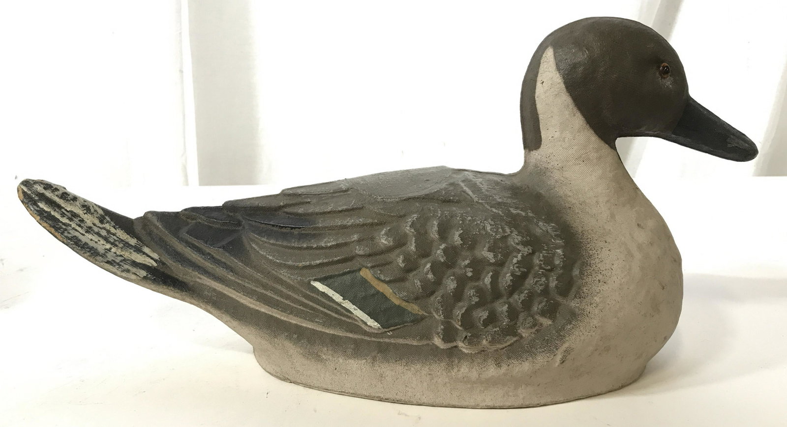 Vintage J.C. HIGGINS Wooden Duck Decoy: This pieces is a vintage, possibly antique, wooden duck decoy. The piece is crafted from wood and sealed in a canvas like material, and hand-painted. The piece measures approx 7.75 inches H, and 16.25