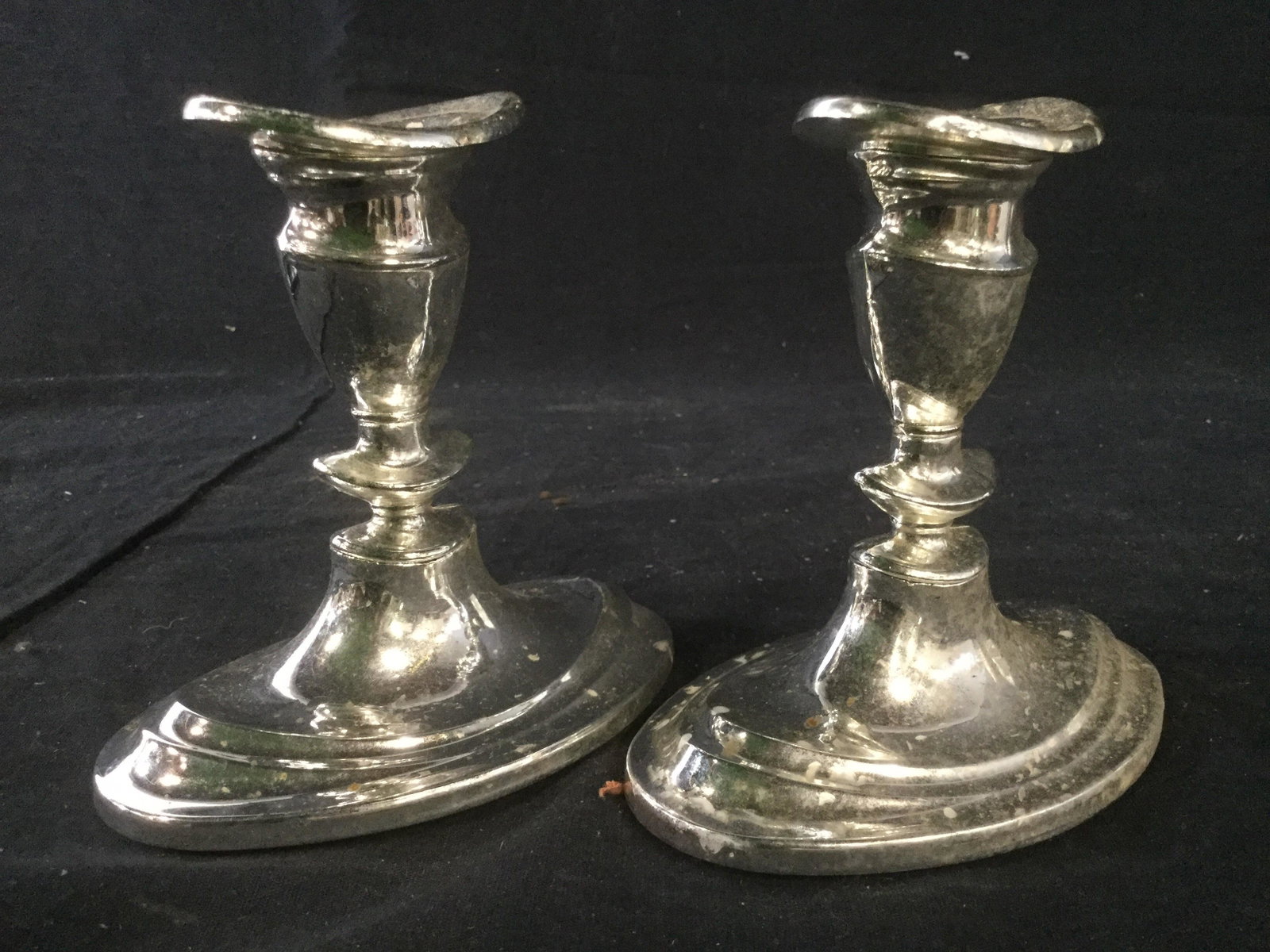 Pair Silver Plated Candlesticks: Candlestick Tags read SILVERPLATED ON ZINC MADE IN ENGLAND. Candlesticks, silverplated Candlesticks, Pair of Candlesticks. Each measures approx 4.5 inches tall and wide 3 inches deep. Each contains so