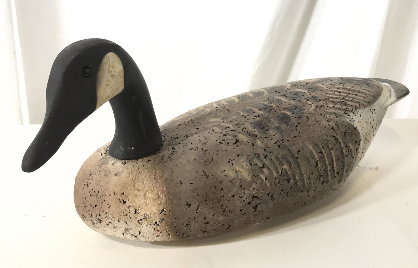 Vintage Wood Canadian Goose Hunting Decoy: This pieces is a vintage, wooden duck decoy. The piece is hand-painted, the head is wooden and can be removed and swiveled. The body appears to be crafted from a cork-like material. The decoy resemble