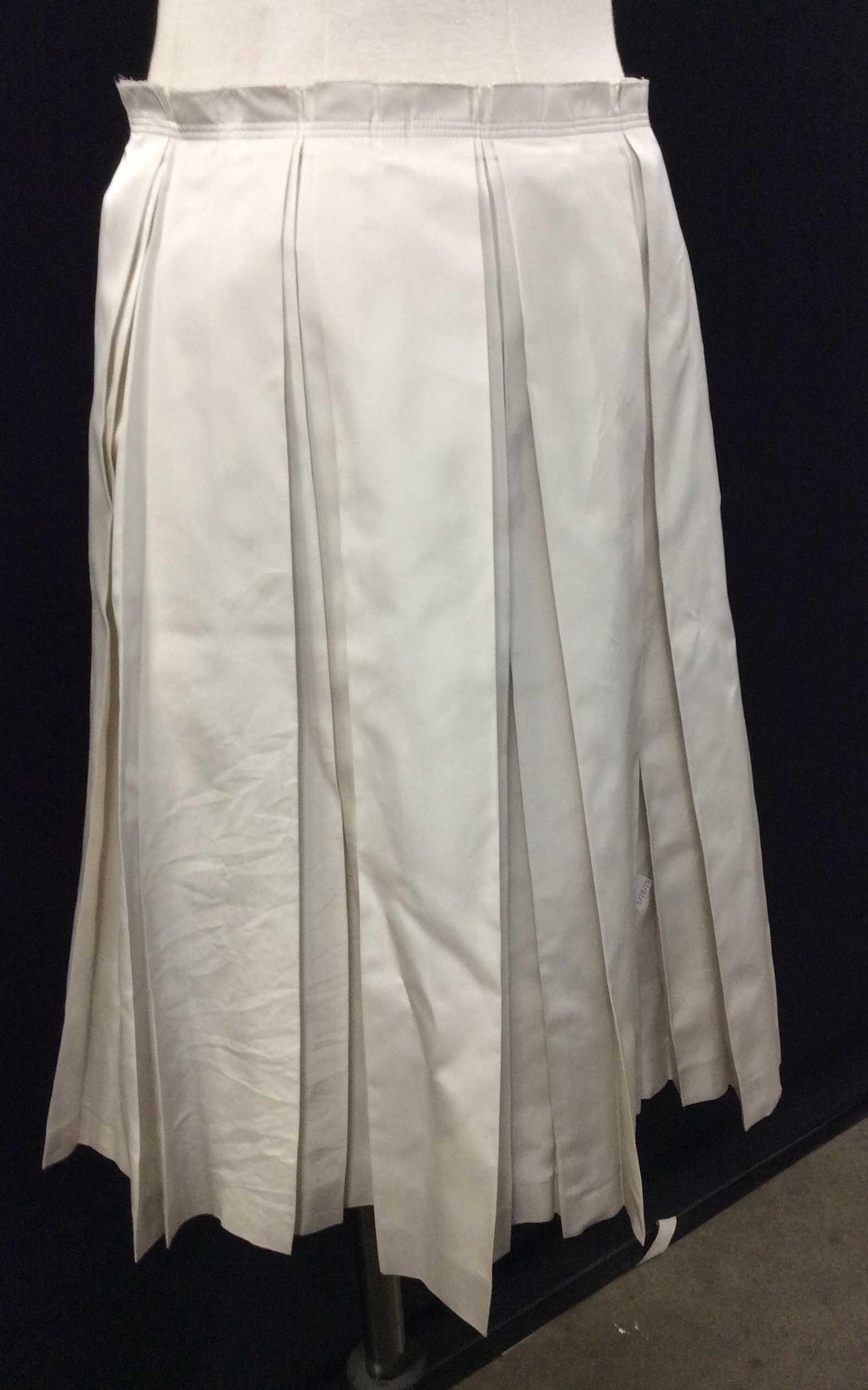 PRADA Silk Pleated Skirt, Sz 40 ITALY: Label reads 100% silk. Designer Fashion label reads PRADA MADE IN ITALY 40. Size Small. Length 24 in. Metallic shine with beige-grey tone. Side zipper, hanger loops. Luxury Designer, Italian Designer,