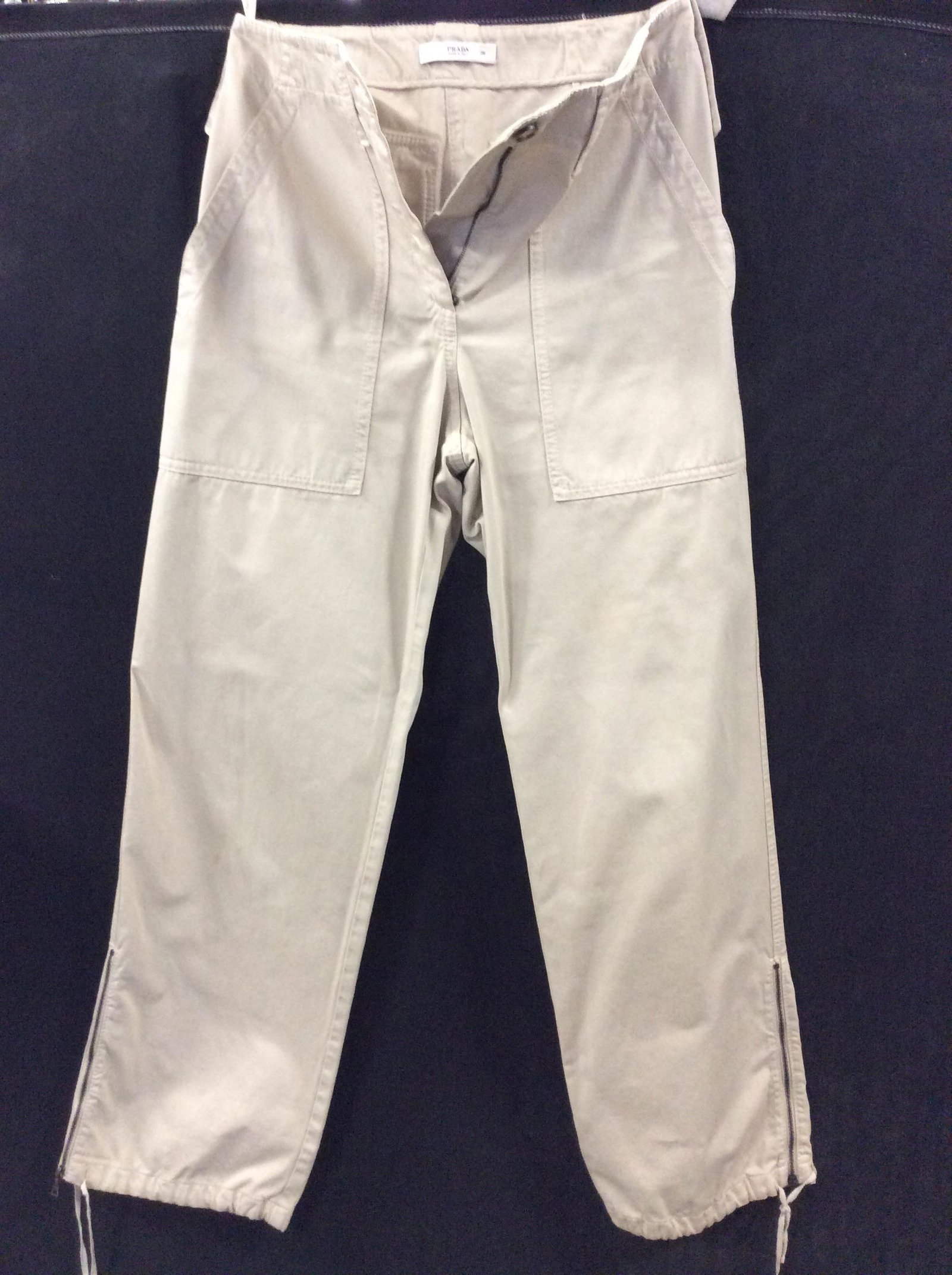 PRADA Cargo Pants, ITALY: Size 38. Beige cargo with cinch ankle and leg zipper. Deep side pockets. Button flap backside pockets. Belt loops, hanger loops. LIKE NEW. Very good condition. Prada cargo pants, XS Designer pants, Lu
