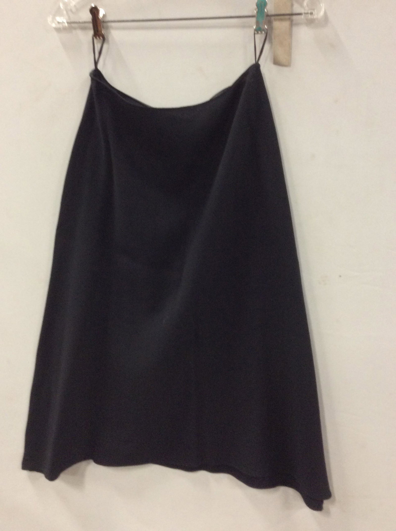 Black Wool PRADA Flare Skirt: Size 38. Side zipper. Length 28 in. Loops for hanging. Sides Drape a bit lower than center. Label reads Prada Made in Italy 38. Fabric label reads dry clean only 55% wool, 45% viscose. Luxury Designer