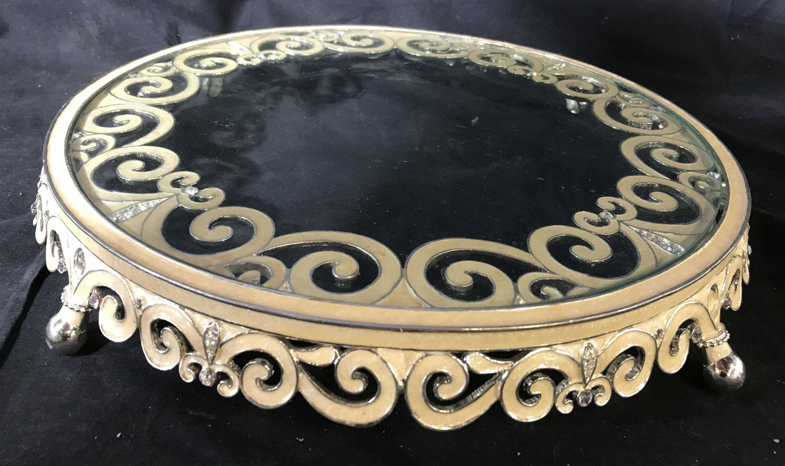 Footed Enamel Glass Vanity Tray: Circular glass tray enamel and silver toned scrolled design, open work border and and four short feet, diameter app 14 inches ht 2.5 inches, decorative accessory, table ware,
