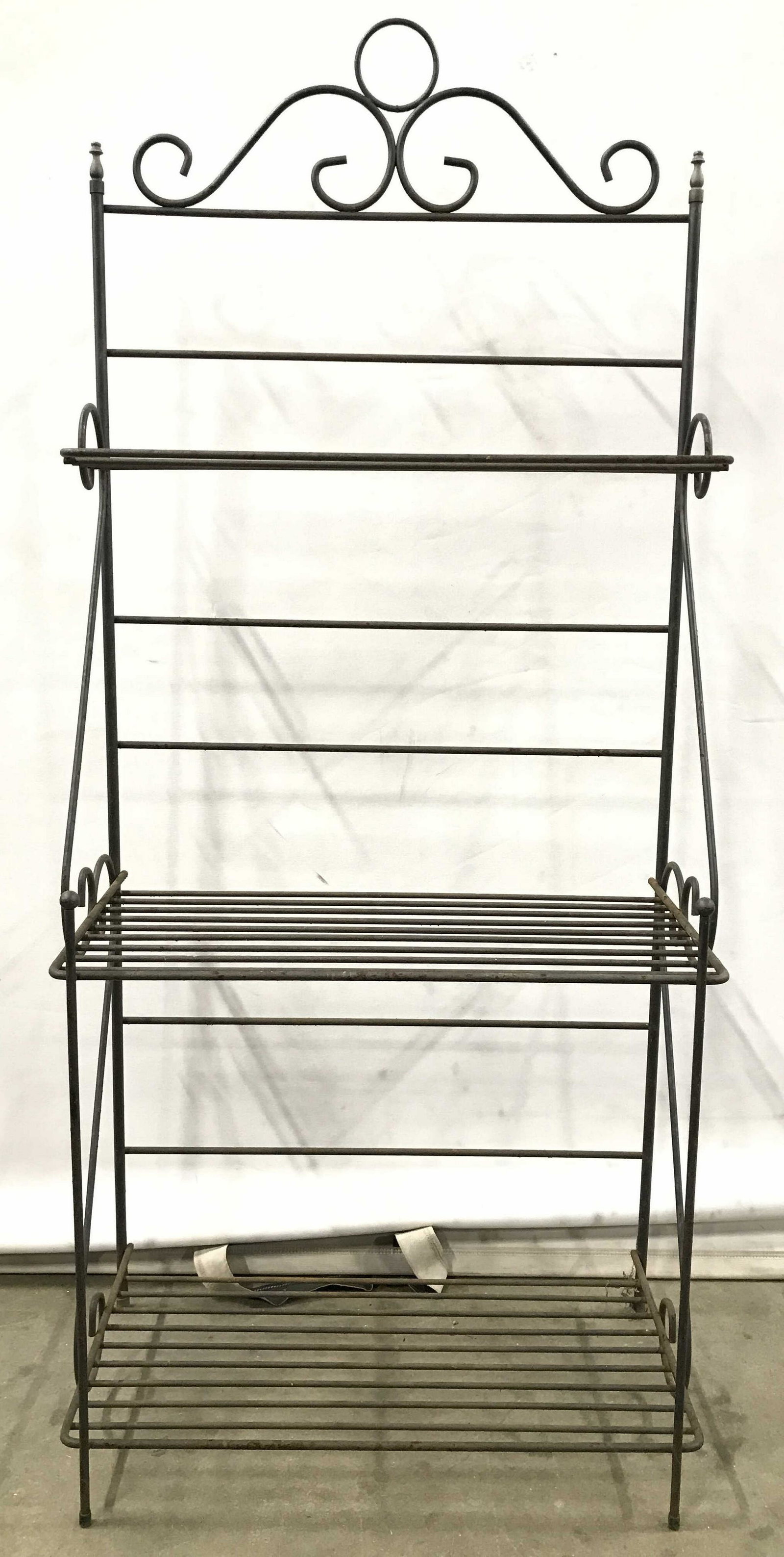 Vintage 3 Level Metal Baker's Rack: Planter rack is black toned & metal. Top and sides of piece has s curve detail. Each has 3 levels. Plant stand, planter stand, planter rack, plant rack, metal plant stand. baker's rack, kitchen furnit