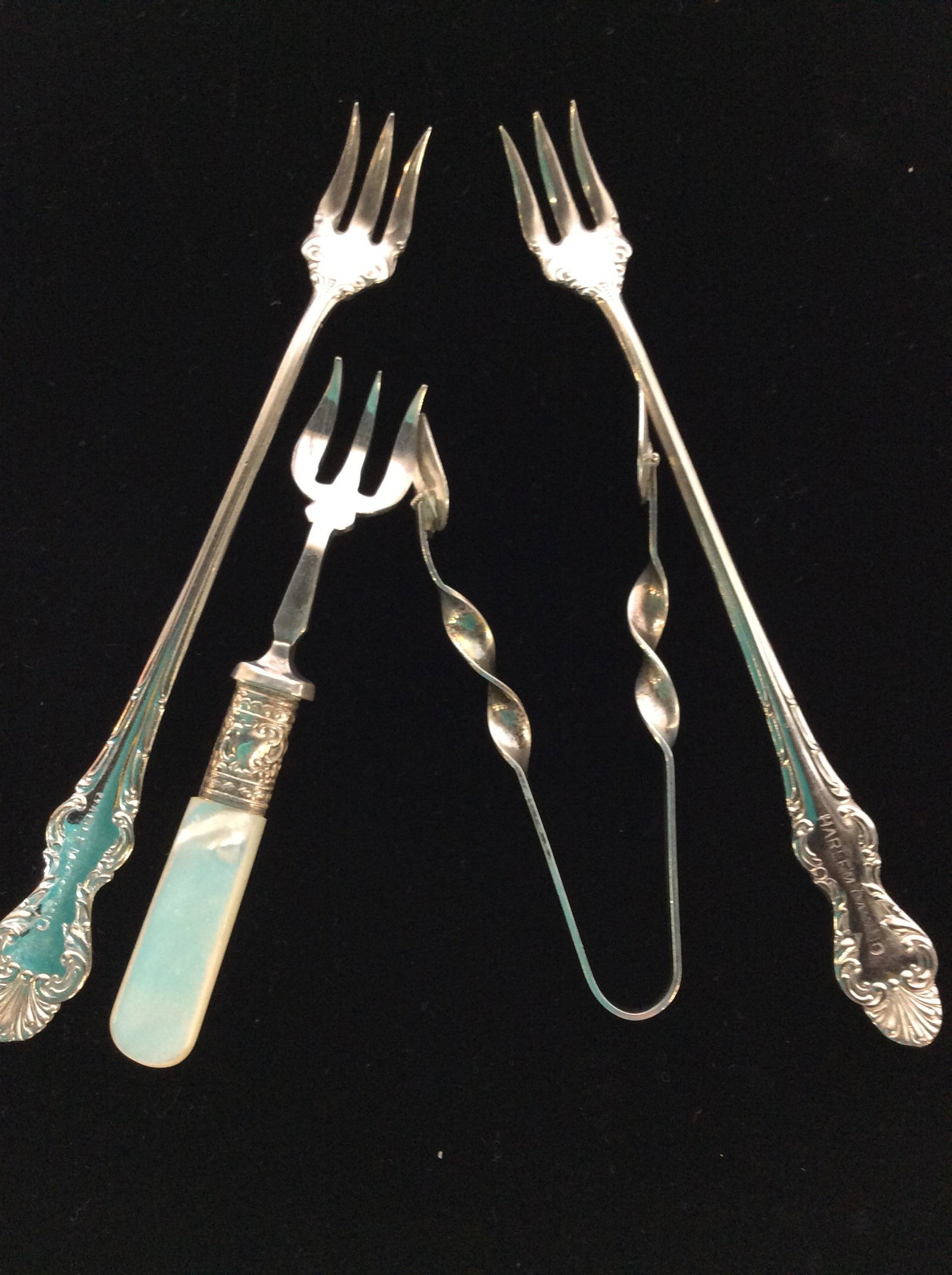 Silver Plated Cocktail Barware, 4 pieces: Two Niagra Falls Silver Co. 1977 Cocktail Forks, impressed on front with ‘Harlem Casino’. 6 1/4 in. Electroplated Appetizer / Cocktail Fork w/ Mother of Pearl Handle. Stamped JB & S in circle with