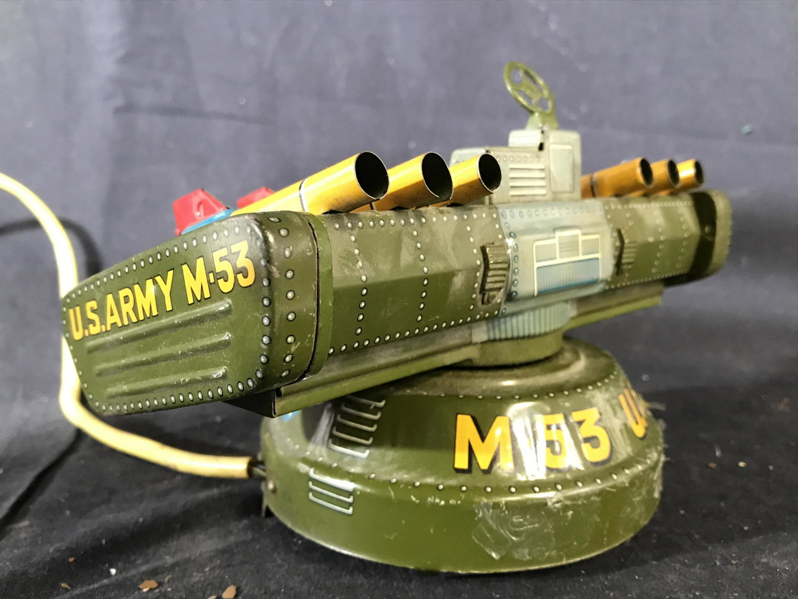 Vintage Metal Army Toy Rocket Launcher: Vintage toy has 6 miniature rocket areas, 2 small levers and 2 small buttons. Vintage army toy, army toy, toy rocket launcher, military toy. piece measures approximately 8 inches long 5 inches tall 3 