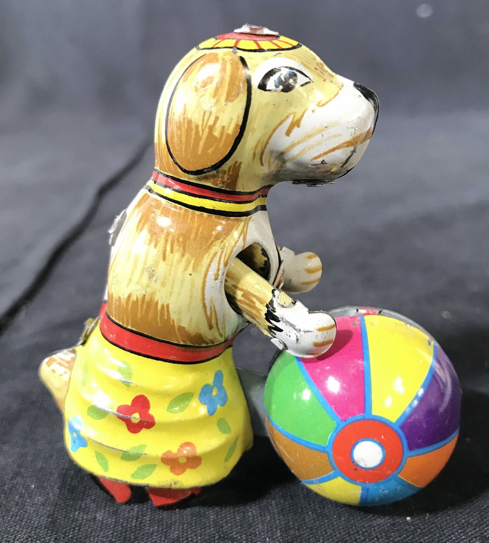 Vintage German Toy Metal Dog W Ball: Underside of piece is marked GERMANY. Piece depicts a dog playing with a beach ball. Piece is metal, appears to possibly be hand painted. toy, collectible, 6