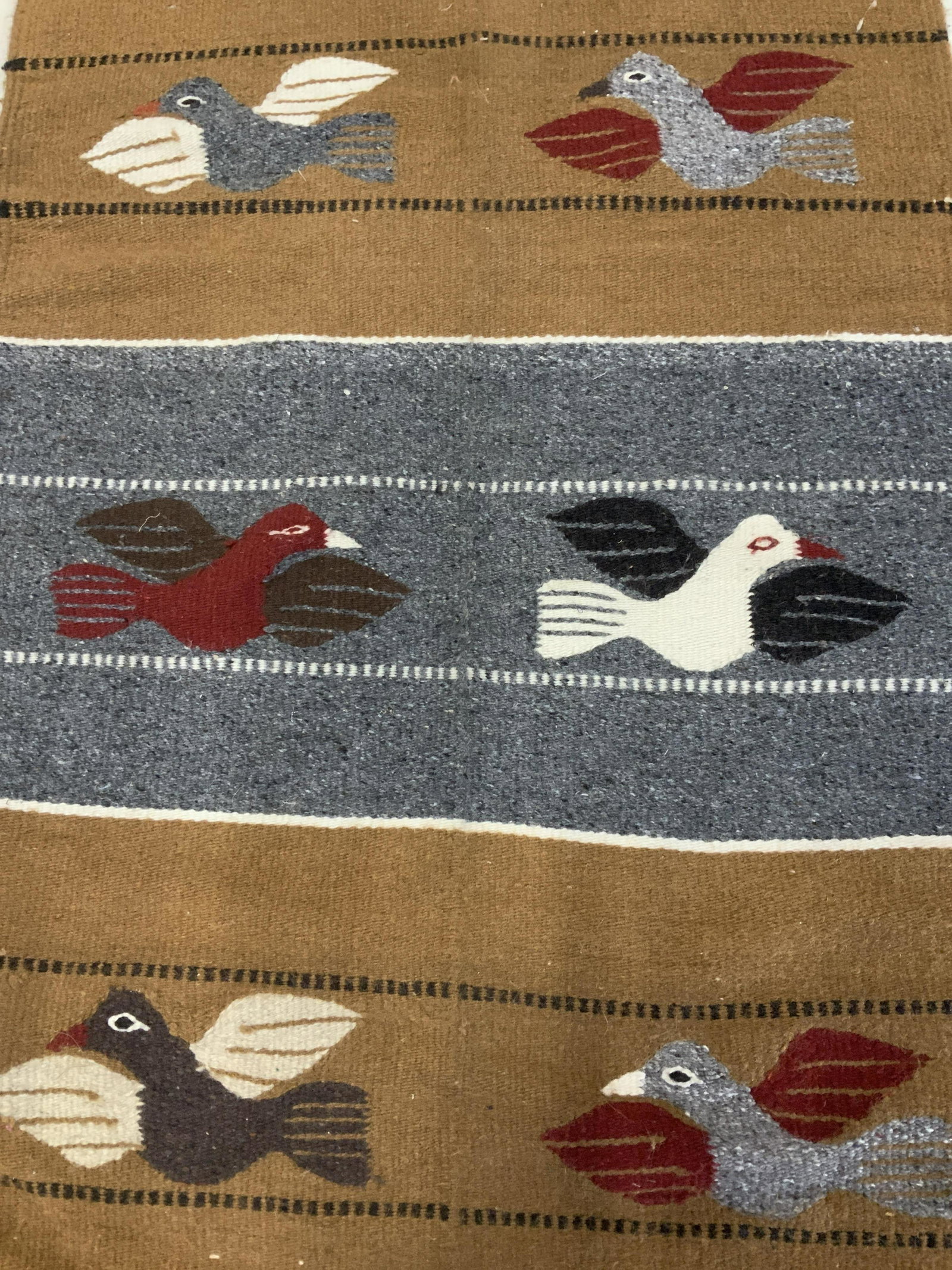 Wool Loom Tapestry: Loom Tapestry, possibly Native American, formed with multi dyed wool to create a vertical lined pattern with birds, primitive designed birds, wooden dowel sewn into top of piece, tapestry in good cond