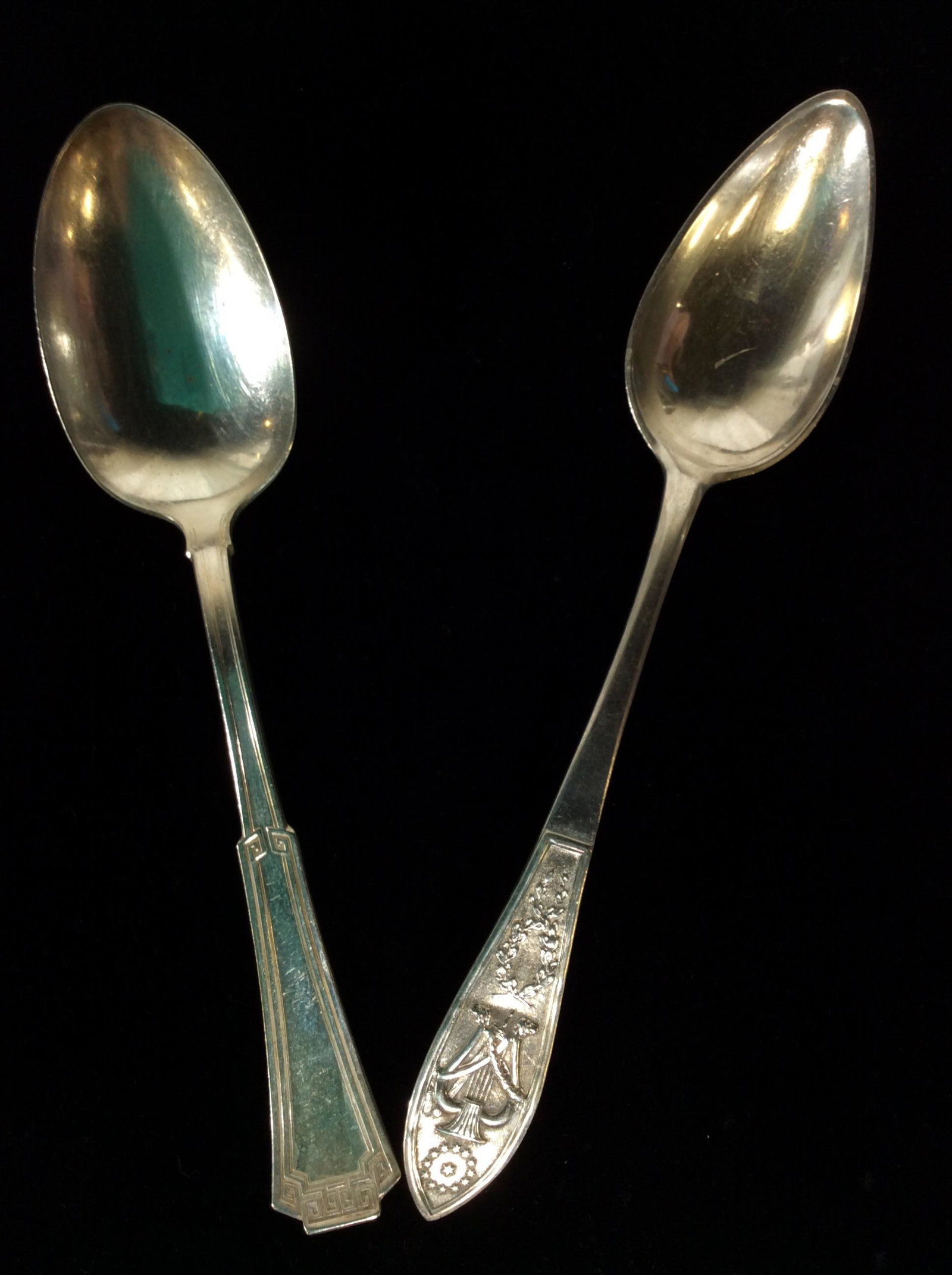 Antique Silver Plated Table Spoons, 2 pcs: Greek Key Pattern On Edge Of Handle, 7 3/4 in long, backside reads 1881 ROGERS A1 , possibly dating early 1900s (1901-1930s). 2nd Spoon has 3 symbols on handle- garland, harp, 12 stars in circle with 