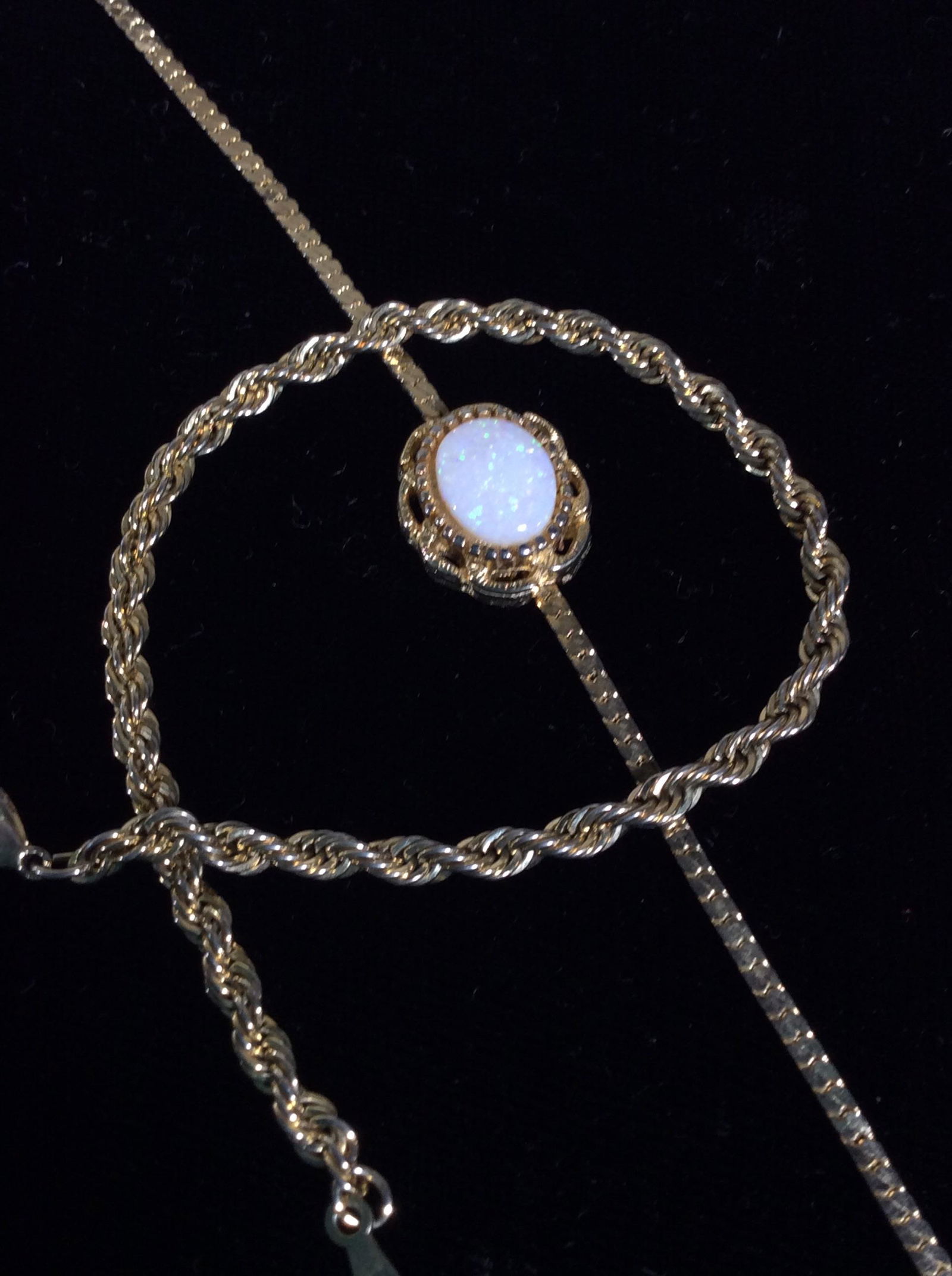 Lot 2 Gold Tone Chain Bracelets, Vintage: Twisted rope bracelet, 7.5 in. long, lobster clasp May need repair, doesn’t fully close. Bone chain link with center 8 x 10 mm costume opal, bezel set. 7 in. Vintage Bracelets, Gold Tone Bracelets,
