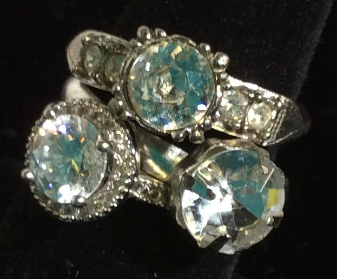 Lot 3 Costume Wedding Fashion Rings: All set in silver tone metal, crystal or rhinestone composite. Rings- solitaire, solitaire flanked by smaller round stones, and halo solitaire. Sizes 7.5 & 8. Each solitaire measures app 8 mm, round. 