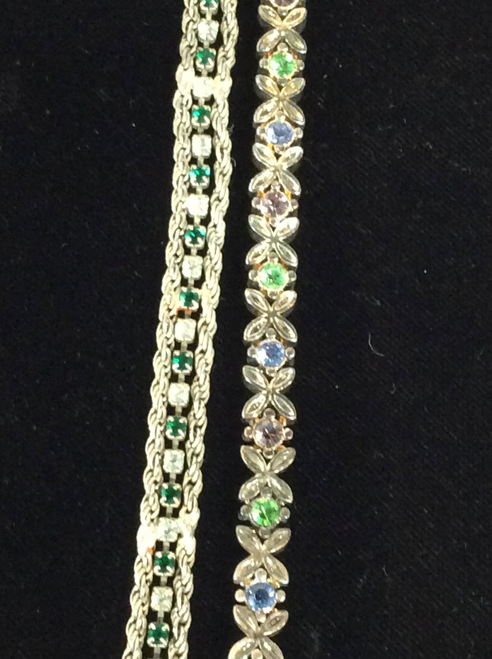 Pair Vintage Art Deco & Art Nouveau Bracelets: Alternating Emerald and clear crystals flanked by layered link chain. Art Deco/ Victorian Style. 7 1/4 in. Floral/ Butterfly marquis shaped clear crystal alternating with pastel multi colored solitair