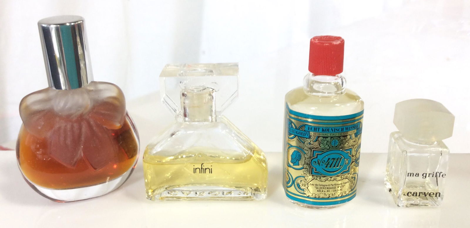 Lot 4 Vintage Perfume Bottle Samplers: 1/2 bottle Infini, Vintage European Eau De Cologne ‘Glockengasse No. 4711’ , Touch of Ma Griffe carven, full bottle unidentifiable Perfume- has frosted glass bow on the front. Fragrance, Ladies Co