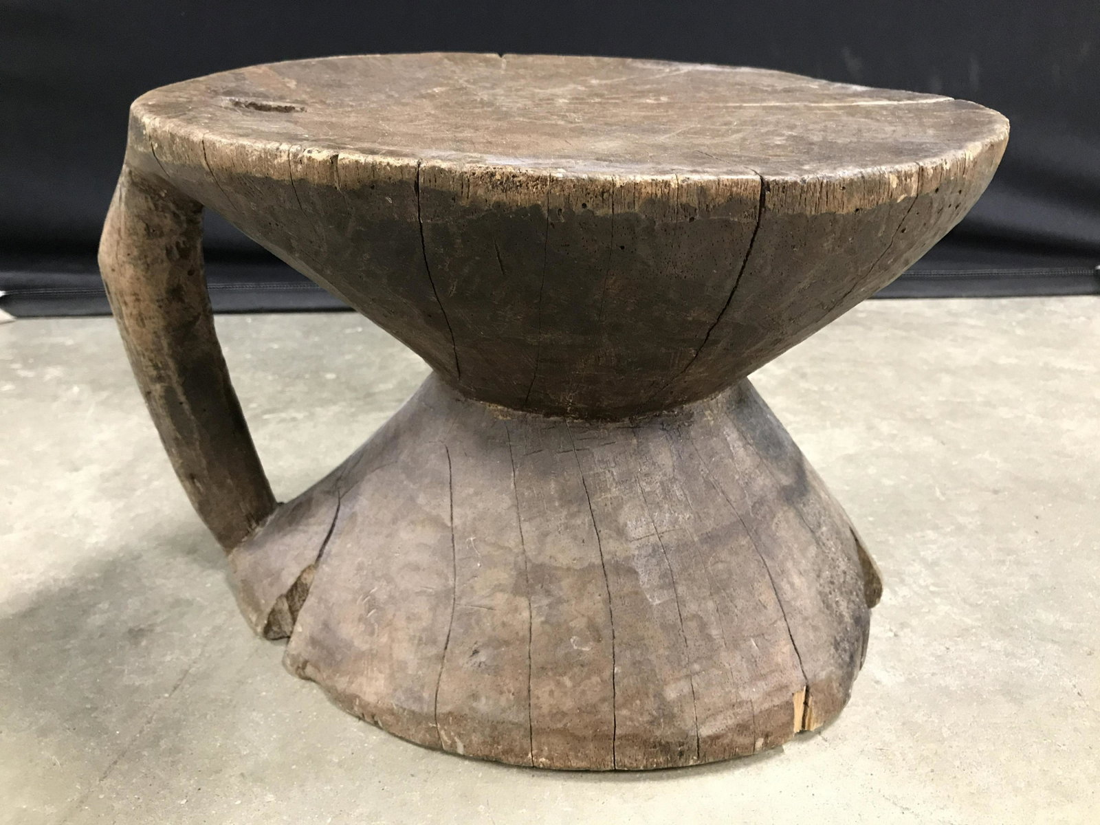 Vintage Stump Style Carved Wooden Footstool: Footstool is wooden. Piece has tree stump style structure. Piece has handle on one side. Footstool, wooden footstool, tree stump footstool, vintage footstool. upscale, plant stand, ottoman. Home furni