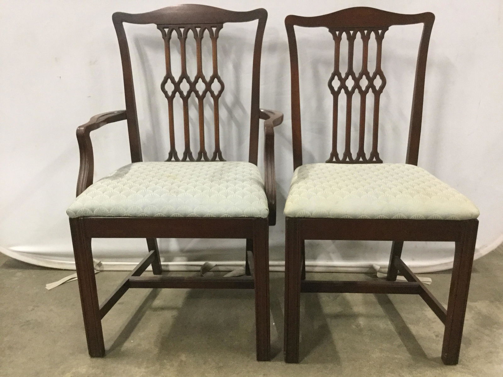 Lot 2 Matching Side & End Chair: Lot includes 1 side chair and 1 end chair. Backrest and seat upholstery match. Legs have stretchers in between. Vintage chairs, dining chairs, carved wooden chairs. End chair measures approximately 38