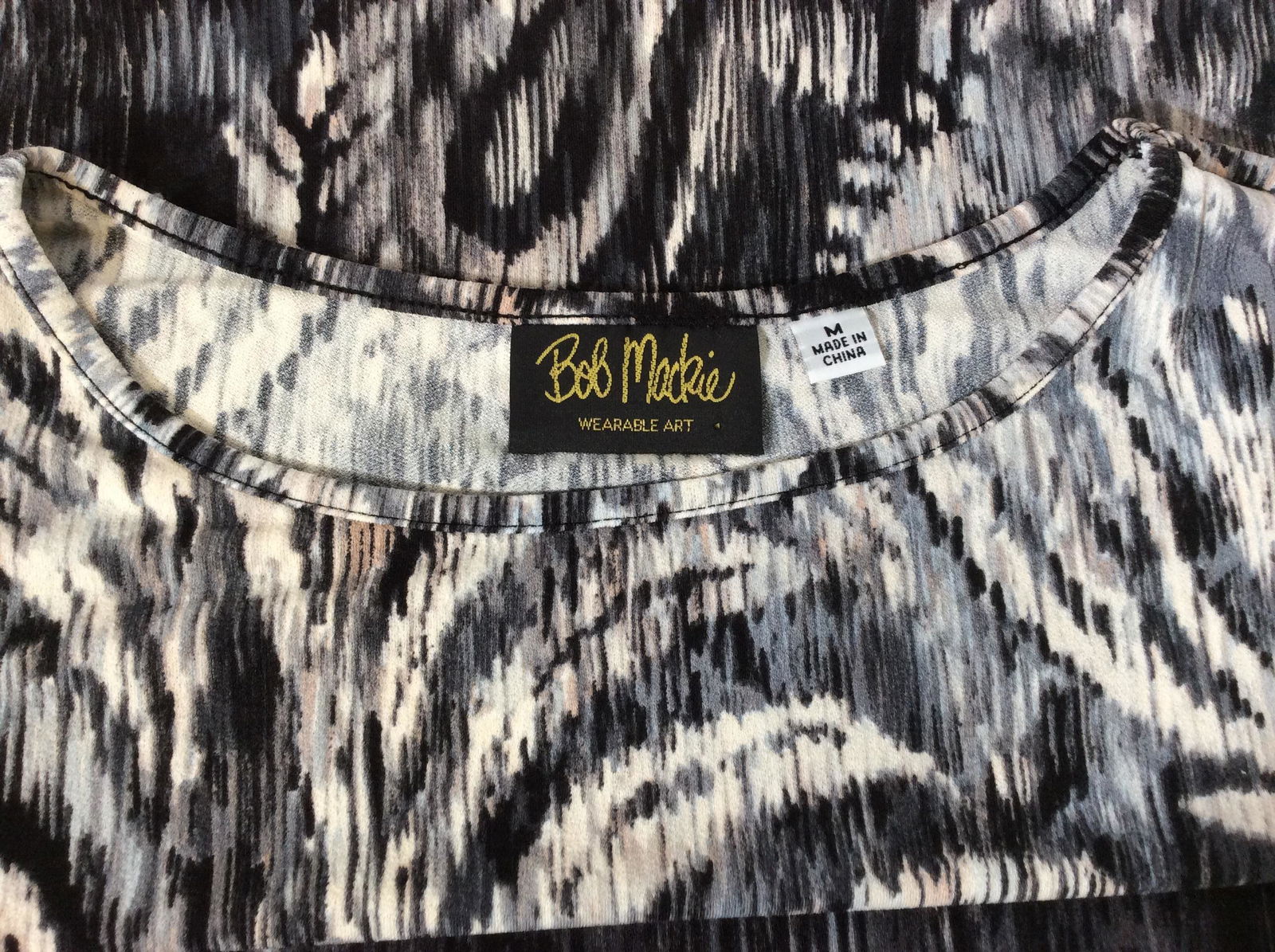 Bob Mackie Wearable Art Print Shirt: Size Med. crew neck, long sleeves, slinky fabric with stretch, possibly nylon spandex combo. 40 in. Waist/ hips. Abstract flower in striated print pattern. Shirt, Top, Long Sleeve Tee, Clothing, Casua