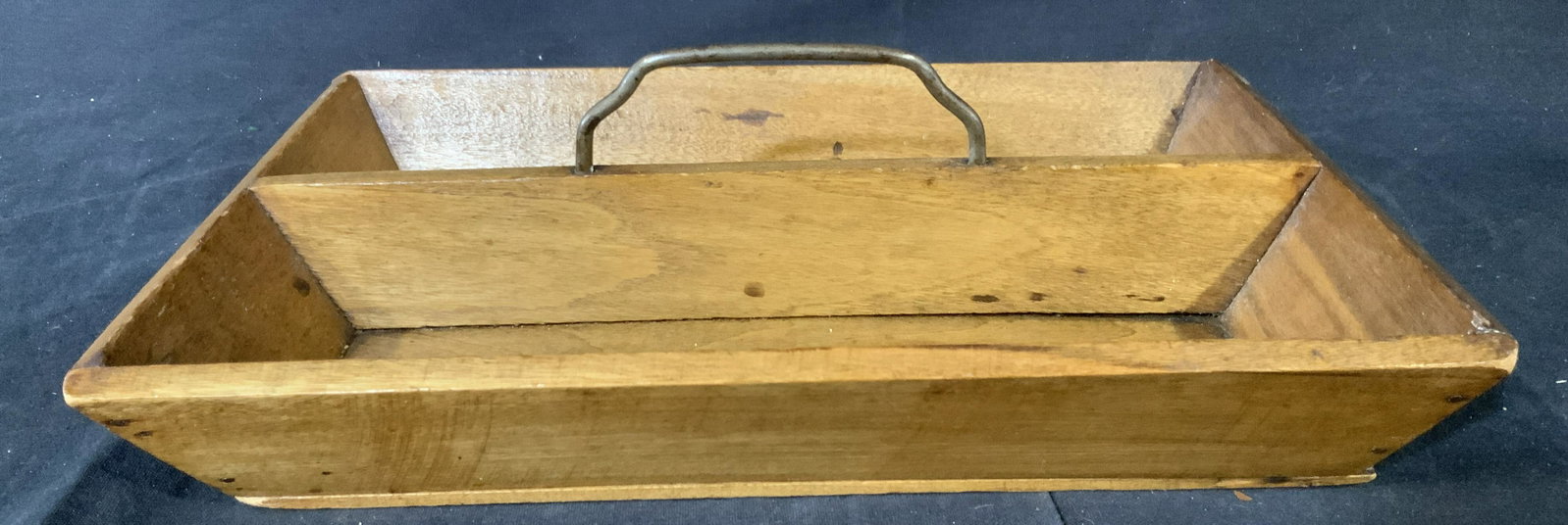 Wooden Wooden Basket with Handle: Wooden divider with metal handle, inspired by colonial tool boxes, this can be the perfect addition to a kitchen or office space, the iron handle sits at the middle of this divider, medium color wood,