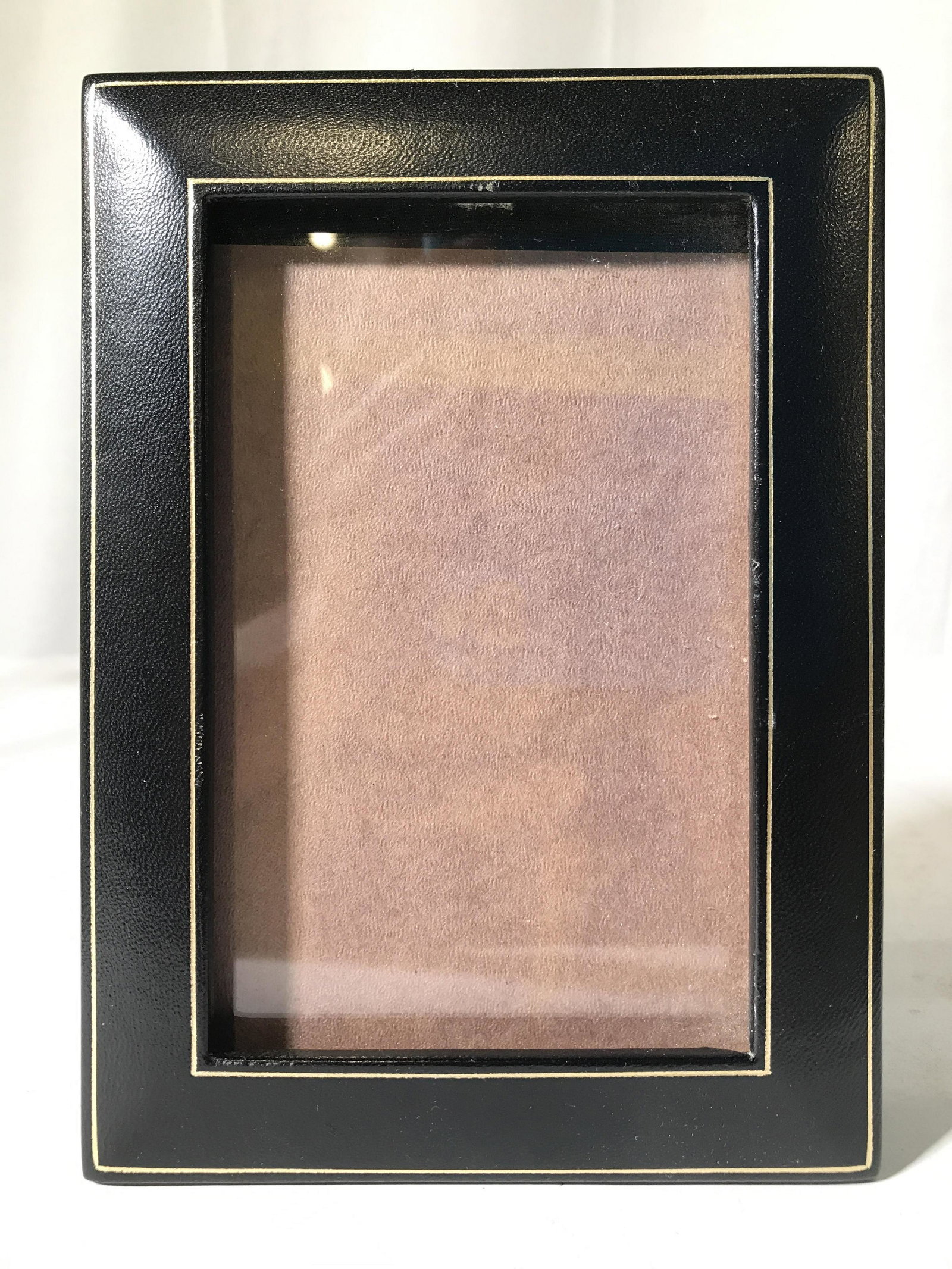 T ANTHONY LTD ITALY Picture Frame: Backside of frame is marked T ANTHONY LTD ITALY. Frame is black toned with gold toned accents. Frame appears to possibly be genuine leather. Piece measures approximately 7 inches tall 5.25 inches wide