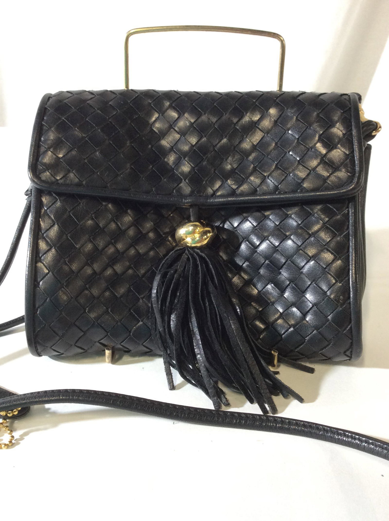 ASPECTS Blk Leather Designer Bag/ Clutch: Basket weave Design, Gold Tone Hardware, tassel Accessory attached to front. Made in Korea ( attached Interior Label) , Metal disc Signed with Designer brand. Detachable Strap, hangs 24 in. Bag dimens