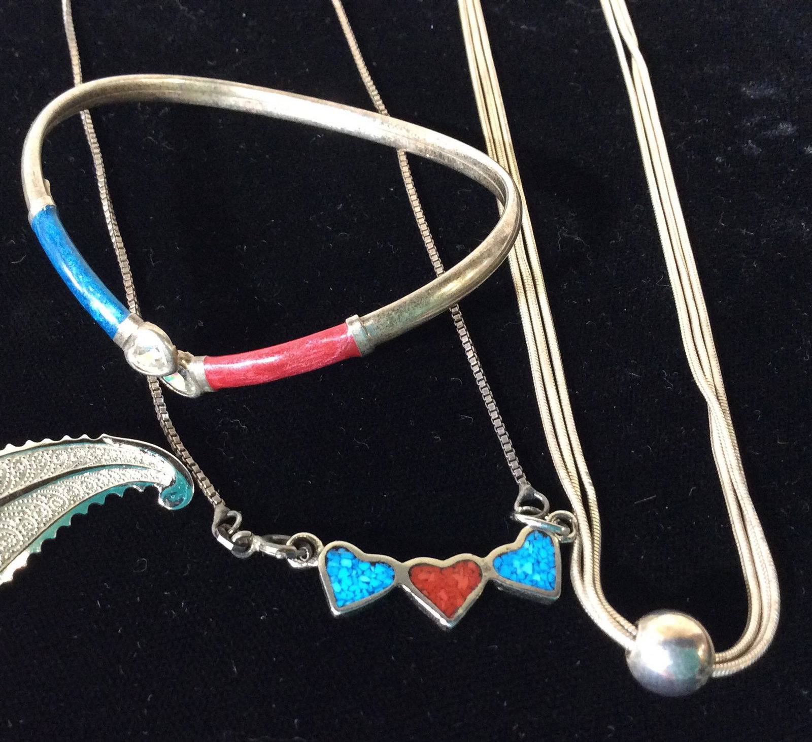 Lot 11 Fashion Jewelry, Sterling, Italy, More: Sterling silver lot, marked, weighed .90 Troy ozt. Includes heart crystal & enamel SS . 925 Cuff. Matching Enamel heart . 925 pendant necklace. Etched paisley design Sterling leaf pin. 3 strand snake 