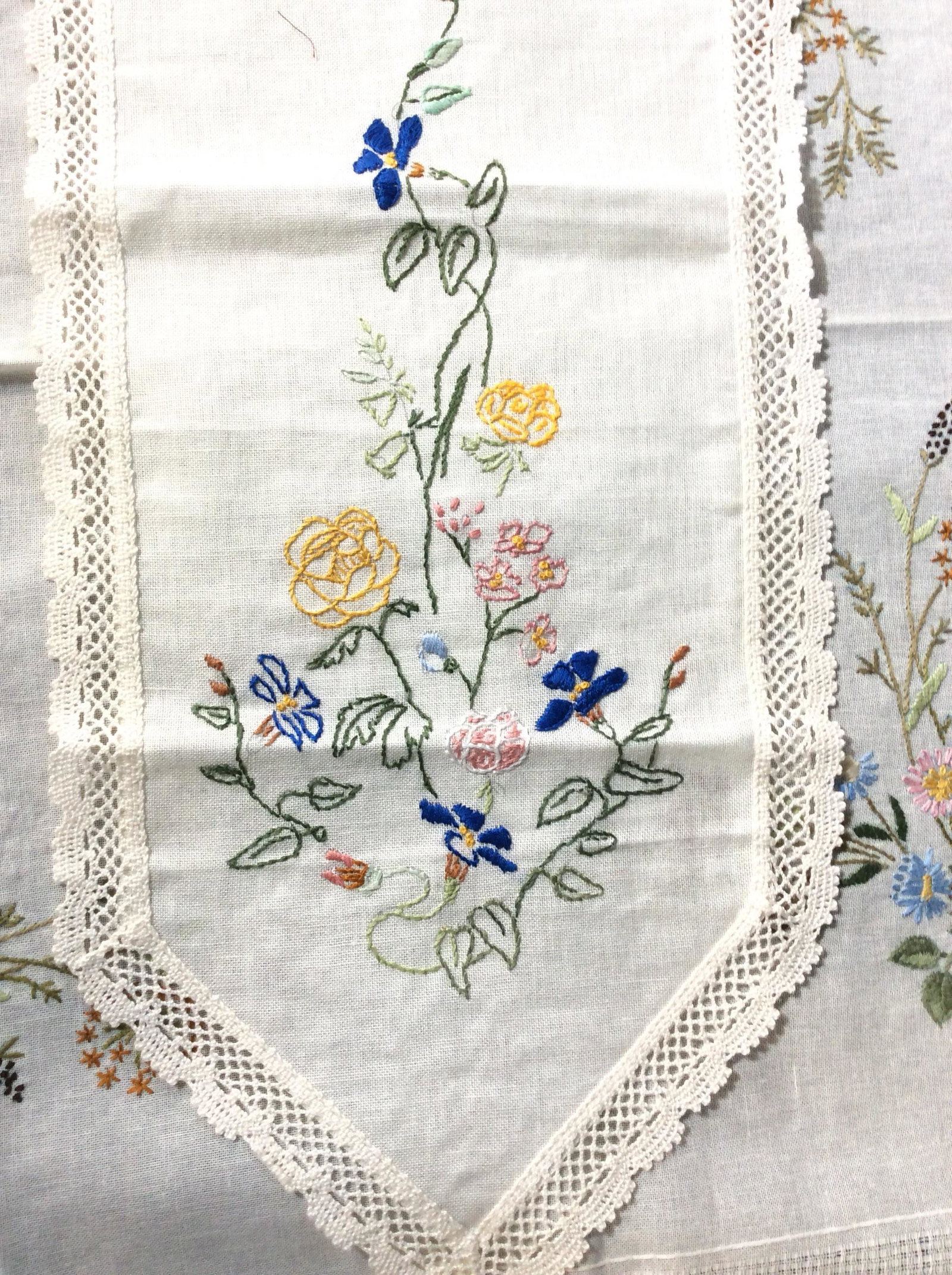 Collectible Hand Embroidered Table Linens, 2: Embroidered Tat Fabric. Square Tablecloth or furniture cover, machine Crocket Border, Hand embroidered wild flowers. Measures 33 x 31 in. Matching Centerpiece Table Runner, 50 in. long, 11.5 in wide. 