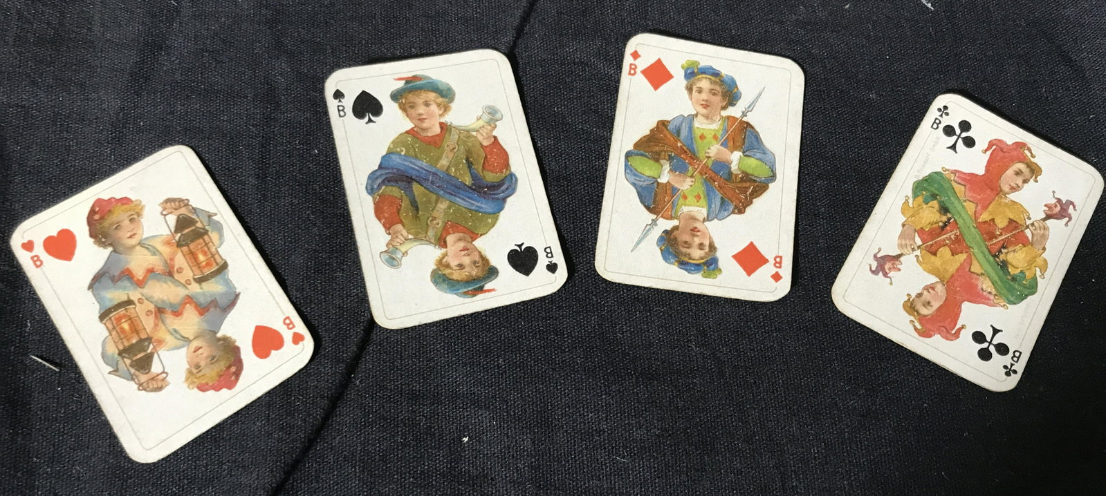 Set of German Miniature Playing Card: Set of miniature playing cards, cards in a leather holder with buckle, all 52 cards in the set are present, on the Jack of Clovers Text reads ‘Frankfurt, B.Dornadorf’, each card measures 2.25 inch
