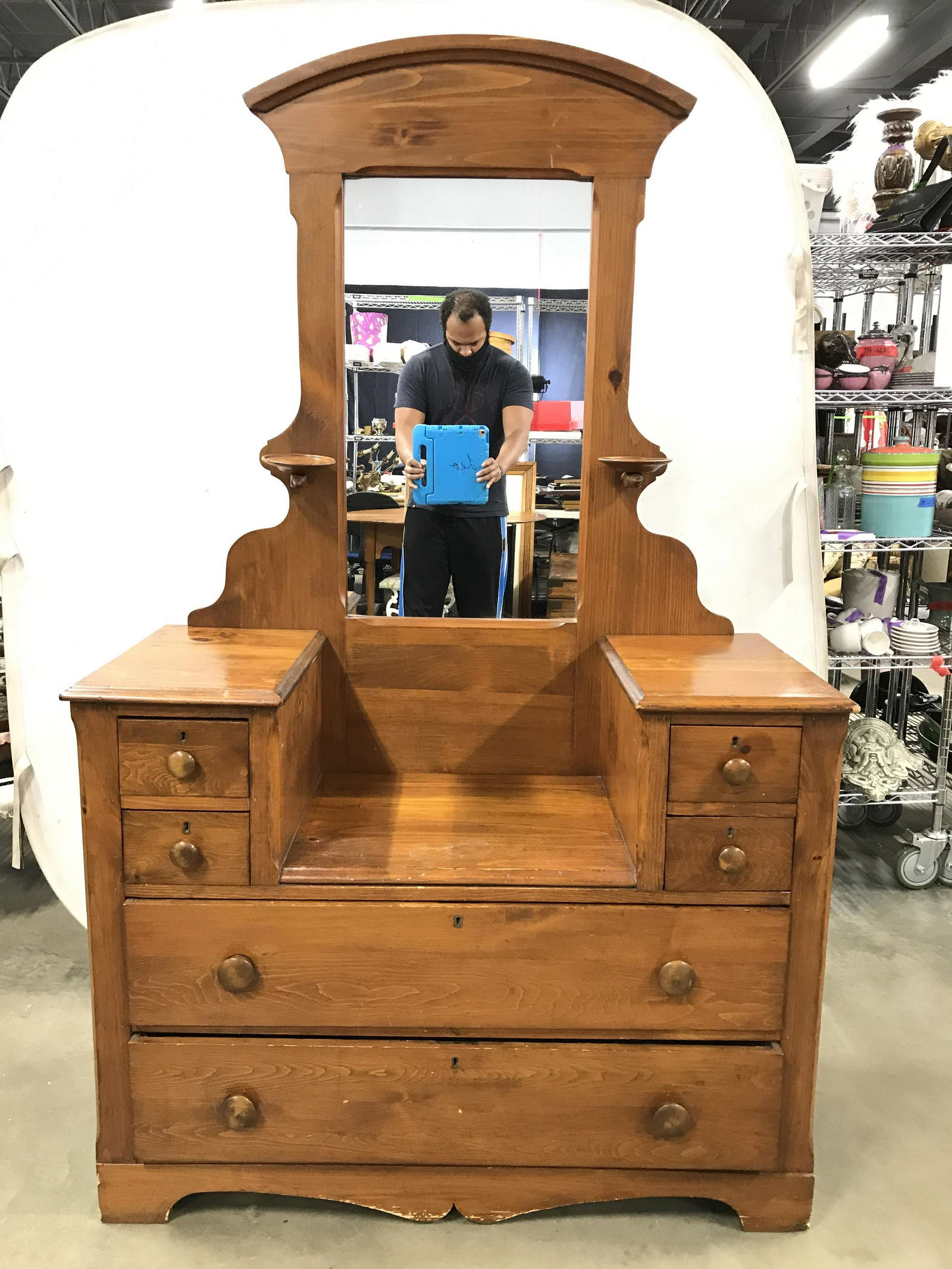 Antique Mirrored Wooden Dressing Table: Dressing table is wooden. Piece contains 5 drawers. Drawers have hand dovetailing & knob style handles. Mirror has candle holders. Measures approximately 81 inches tall 43 inches wide 19 inches deep.