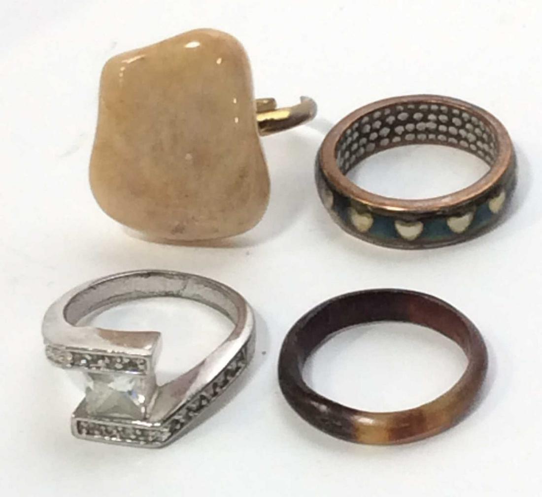 Lot 9 Fashion Rings, ladies estate costume jewelry: Various Rings, sizes and styles. Polished Natural stone ring, app Sz 6.5, heavy on hand. Retro crystal cocktail ring, princess cut center flanked by rounds, Sz 8. Natural shell band , similar to torto