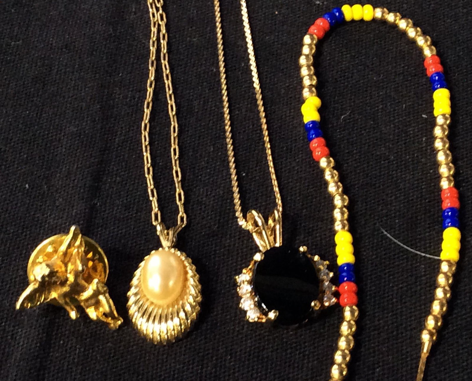Lot 6 Jewelry Accessories, 18K Bracelet: 18 K Gold Bracelet with colored beads alternating with gold tone beads. reads 18K and GD On Chain Link, 7 3/8 in. Cherub Putti Lapel Pin. 2 Chain Pendant Necklaces, one cable chain 15 in pearl pendant