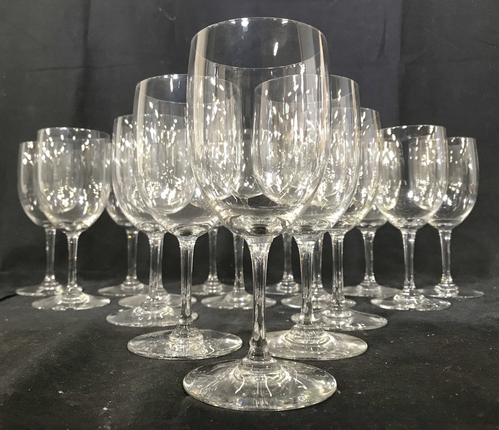 Set 16 BACCARAT Crystal Stemware: Lot includes 16 wine glasses. Each are marked BACCARAT FRANCE on underside. Each piece is crystal. All measure approximately 6 inches tall 2.5 inches wide. Baccarat, baccarat stemware, stemware, Cryst