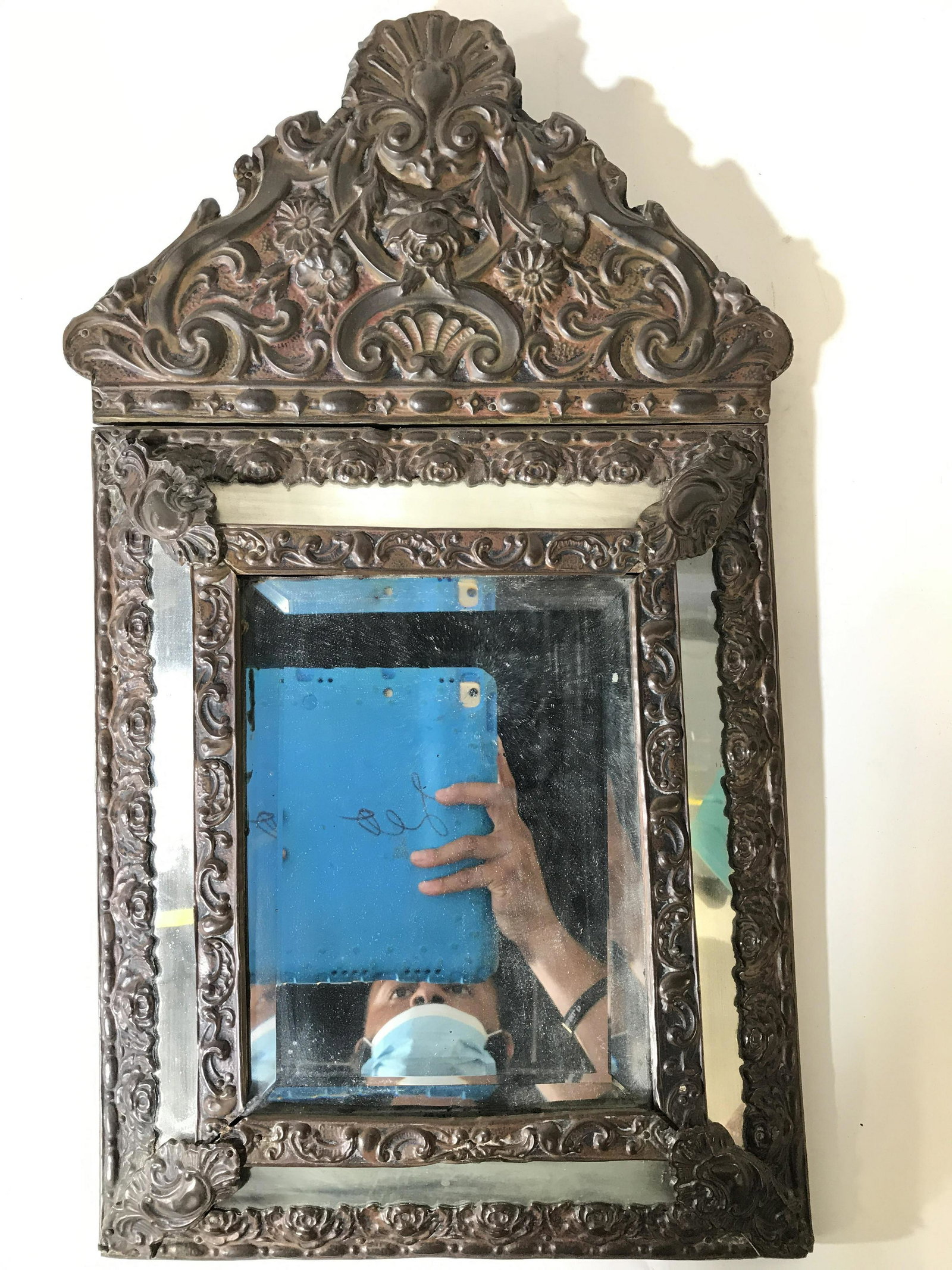 Antique French Scroll Metal Frame Beveled Mirror: Mirror is antique. Piece has metal frame with intricately detailed c and s scroll detail along with floral and leaf detail. Center mirror panel is beveled. Piece has 4 additional mirror panels which s