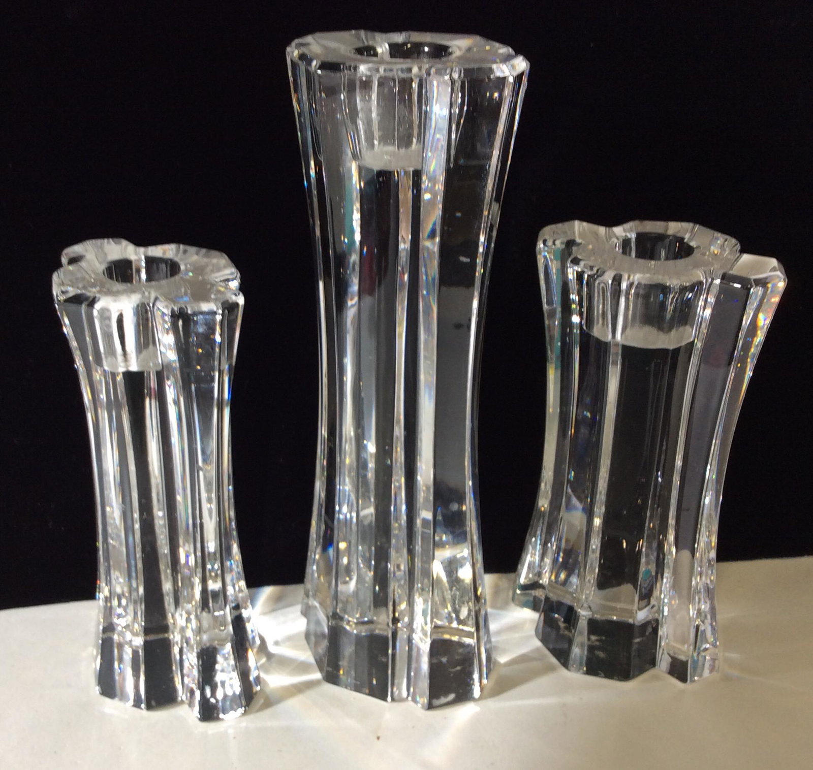 Set 3 SIGNED ORREFORS Crystal Pillar Candlesticks: Luxury Designer Crystal Candlesticks, Sweden. Crystal Candlesticks, possibly lead crystal, Each Hand Signed ‘Orrefors’ . Manufacturing officially closed in 2012. Weighted items. All same design, m