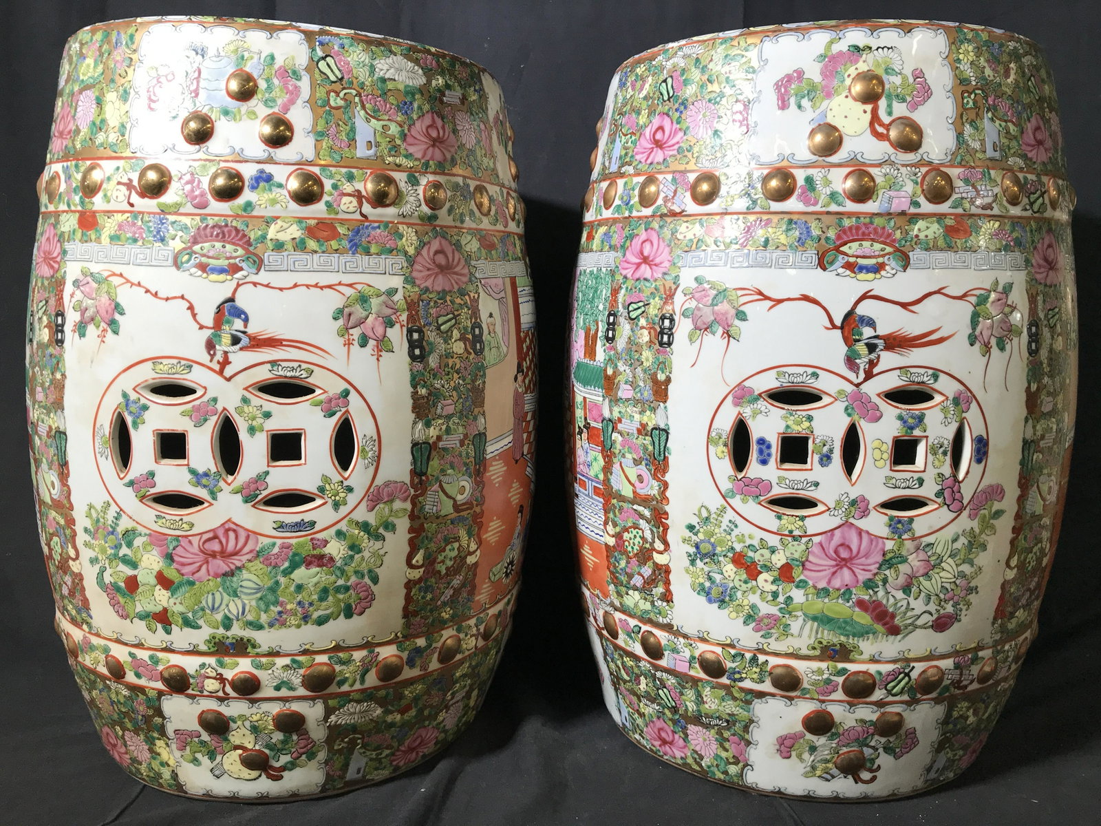 Signed Chinese Porcelain Garden Stools: Garden stools are signed on underside with Asian Characters. Each piece has intricate multi toned floral leaf vine and additional detail. Each piece appears to possibly be hand painted. Pieces are vin