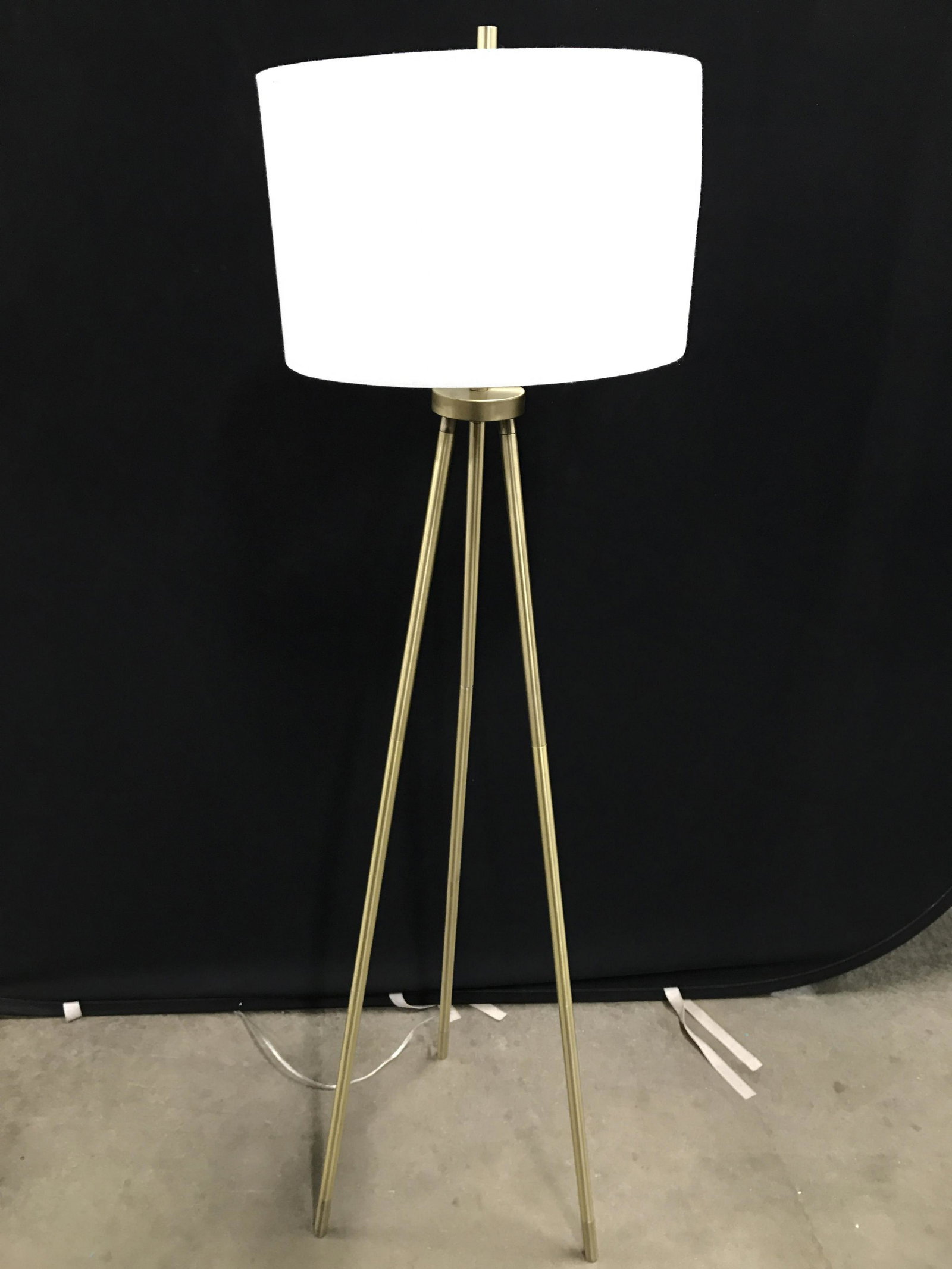 Gold Toned Tripod Floor Lamp: Measures approximately 61 inches tall 16 inches wide. Home lighting, lamps, lights, home decor, contemporary lamp, contemporary lighting, modern decor. home lighting,