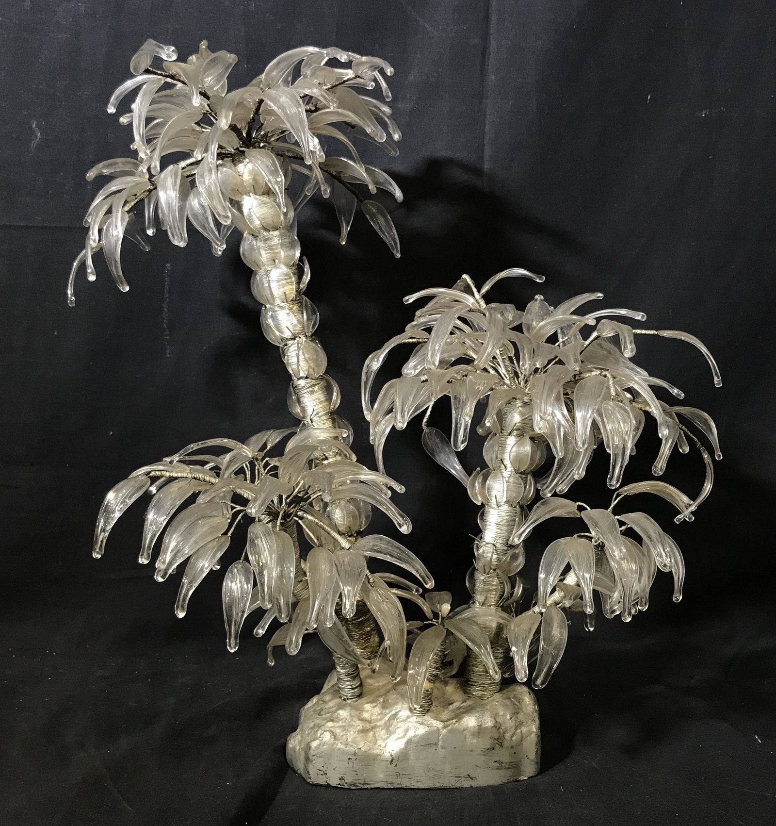 Multi Media Art Glass Palm Tree Statue: Multi Media Glass Palm tree Statue, no apparent signature, primarily made of glass in the shape of leaves, possibly has ceramic elements covered in silver toned paint and silver toned metal wiring, su