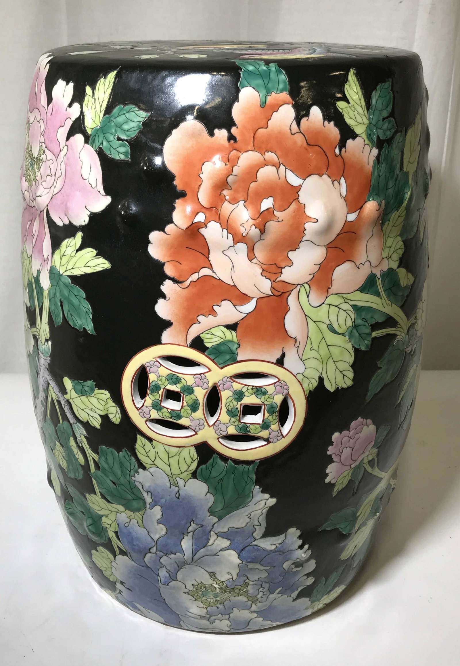 Asian Style Ceramic Lotus Garden Stool: Asian Style ceramic lotus garden stool, stamp to bottom reads made in China, stamp to bottom reads 78, subject a ceramic stool with lotus and leaf designs throughout on a black background, entirely ho