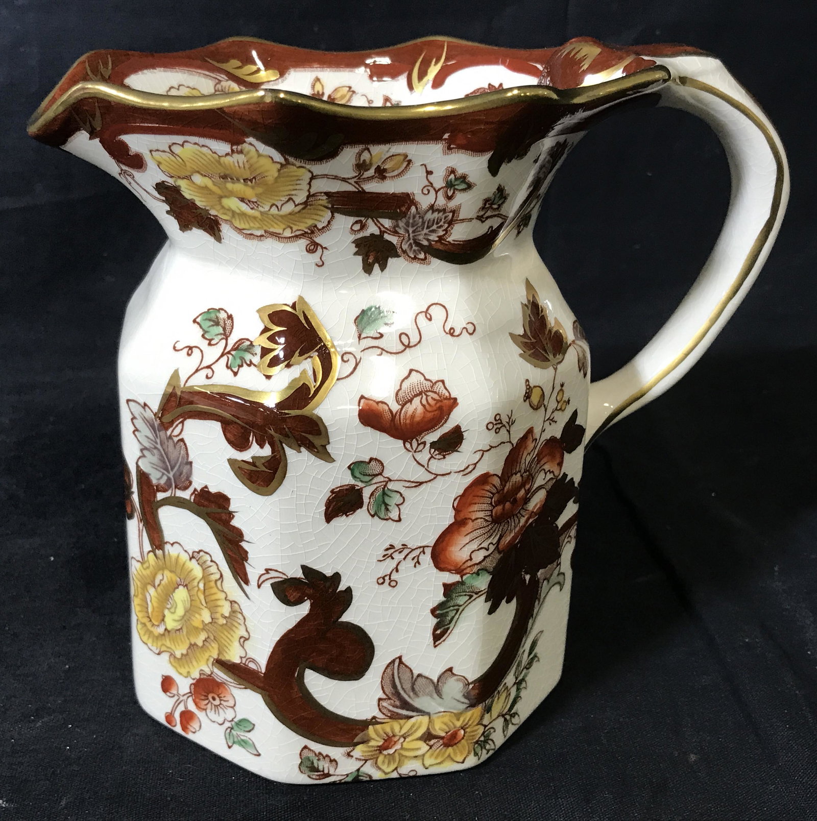Mason’s Brown Velvet Ironstone Porcelain Pitcher: Hand Painted Porcelain Pitcher, bottom reads ‘Mason’s Ironstone Brown Velvet Made in England’, subject a brown red and yellow floral designed pitcher with gold accents, measures 6.75 inches tall
