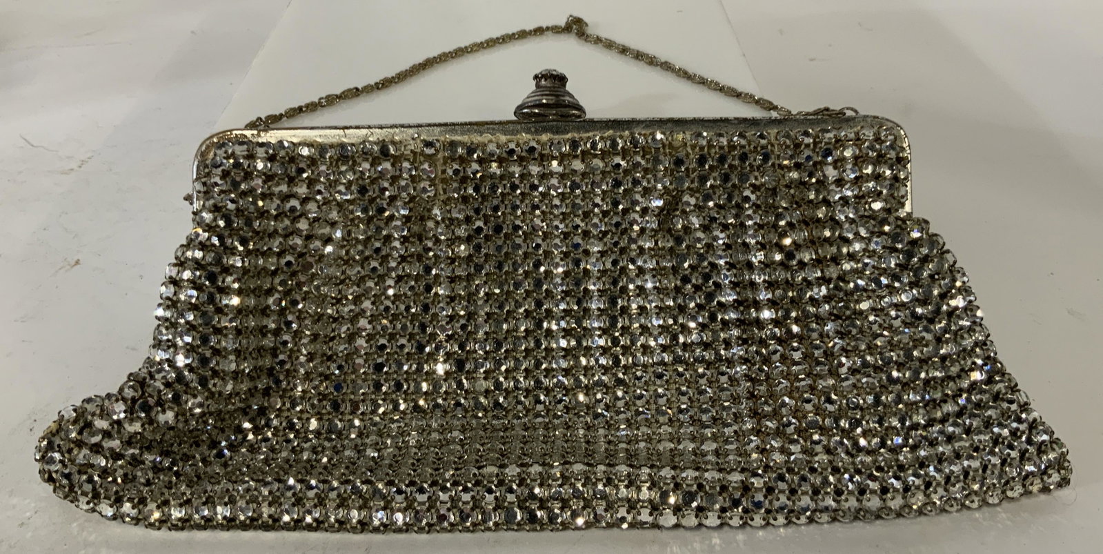 Jordan Marsh CO Vintage Rhinestone Purse: Vintage bedazzled rhinestone purse with Solitaire Rhinestone closure, Inside tag reads: made in western-Germany expressly for Jordan Marsh Company Boston, bag has chain strap, inside silk fully intact