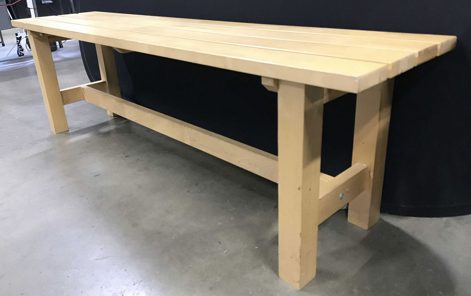 Outdoor Tan Toned Wooden Bench: Bench is tan toned and wooden. Piece appears to be for outdoor use. Upcycled indoor bench. Piece measures approximately 59 inches long 14 inches deep 18 inches tall. Bench, wooden bench, outdoor bench