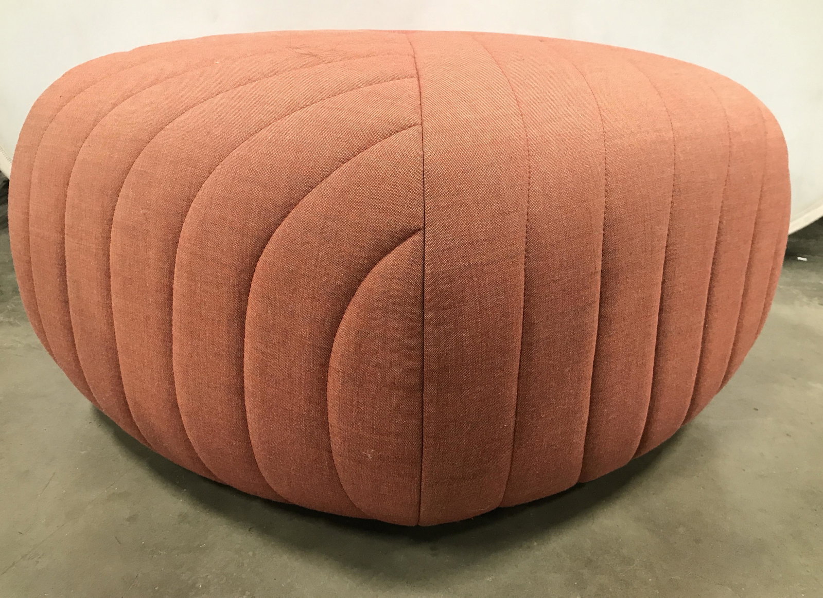 Mid Century Modern MUUTO Remix 5 Pouf: Pouf is MUUTO. Piece is tangerine toned. Piece has crossed upholstery. Mid century modern, Danish modern, mid century modern pouf, Danish modern pouf, remix 5 pouf, MUUTO pouf, MUUTO ottoman, ottoman,