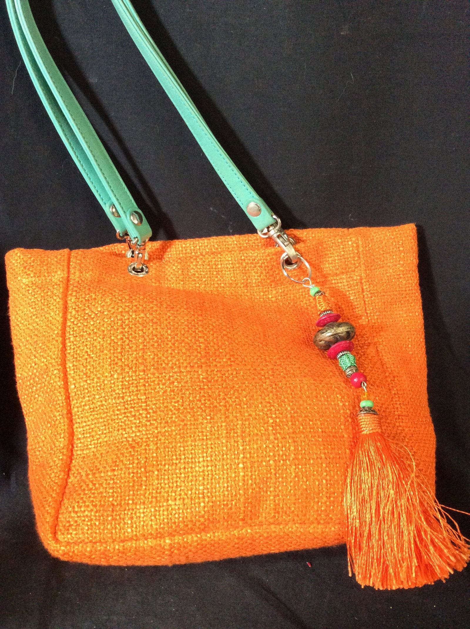 UN JOUR UN SAC Signed Burlap Handbag, France: Luxury Designer, bright orange woven burlap, paired with Aqua Leather Handles, Drop app 9 in. Handle are removable, lobster claw hooks. Silver tone hardware metal including signed CHARM, reads UN JOUR