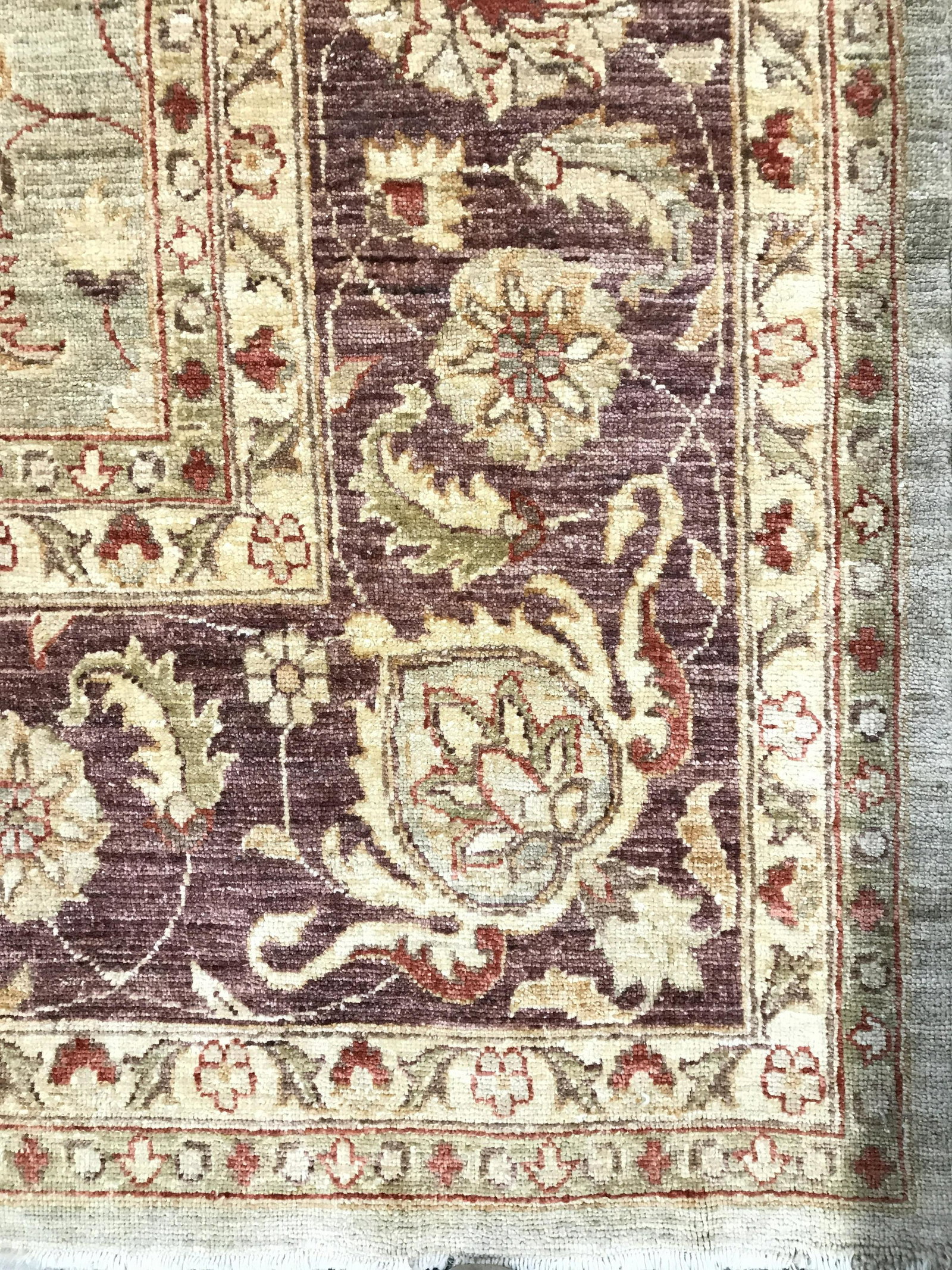 Vintage Handmade Room Size Wool Rug: Rug is wool and handmade. Piece is vintage. contains multi toned floral vine & leaf detail including tones of red, gold, beige, tan & brown. Rug has vet small fringes. Rug, carpet, area rug, wool rug,
