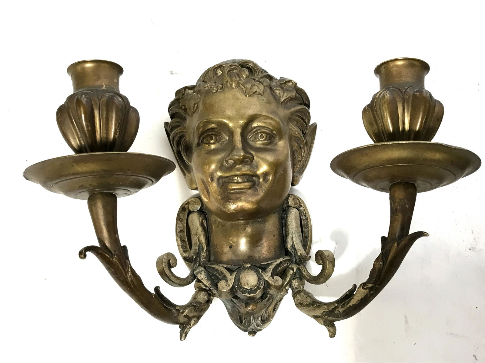Pair of Antique Gilded Bronze Wall Sconces: Pair of Vintage possibly antique gilded bronze wall sconces, Each are made in candelabra style with two arms, done in a rococo art nouveau-esque style, base of sconce is an elvish face with pointed ea